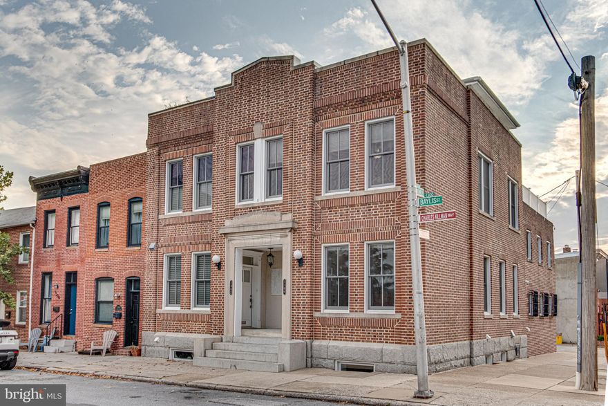 Welcome to 1300 Baylis St, a beautifully renovated end-of-group Canton rowhome offering modern style, comfort, and unbeatable city convenience. This super wide home with private parking and two roof decks features 4 bedrooms, 3 full baths, 2 half baths, and four finished levels designed with a clean and contemporary  boutique feel.

Step inside to a bright open-concept main level with new flooring, recessed lighting, and a stunning designer kitchen complete with shaker cabinetry, stainless steel appliances, quartz countertops, tile backsplash, and an island perfect for cooking and entertaining.  Whether you are cooking meals, hosting game night or enjoying a morning coffee, this kitchen is built for everyday living and effortless entertaining.

Upstairs you’ll find three spacious bedrooms filled with natural light from the home’s 28 windows. The luxurious primary suite includes a spa-like bathroom with modern tilework, a rainfall shower, and body jets. The finished lower level offers a second living room, an additional bedroom, and a full bath—ideal for guests, a home office, a gym, or movie nights.

Outdoor living is exceptional with a private parking pad and a two-level roof deck offering sweeping city views and epic sunsets—perfect for entertaining or unwinding.

Located minutes from Patterson Park, Canton Square, Johns Hopkins, the waterfront, and the best of Baltimore’s dining and shopping.   Some nearby favorite spots include Gunther’s, Canton Crossing, Merritt Athletic Club, Sprouts, CorePower Yoga, DiPasquale’s, and more. The home is districted for Hampstead Hill Academy (9/10), one of the city’s top schools.

Move-in-ready with modern upgrades, breathtaking views, and an exceptional location, 1300 Baylis St is the perfect place to call home.  Schedule your tour today!