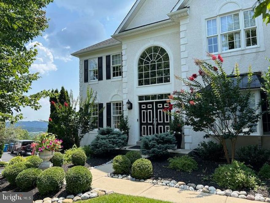 Spectacular home with many custom upgrades situated on private cul-de-sac with expansive views of Downingtown and the surrounding area. Kitchen remodel - 2022, Main bath remodel " 2023. Beautiful custom covered deck with retractable awning. Marble foyer leads to a circular oak staircase. Fantastic open floor plan has been upgraded with Brazilian Cherry Hardwood flooring, costing $30,000, which accents the 10 ft ceilings on first and second floors. A gourmet kitchen, completely remodeled in 2022 with granite countertops and quartzite island, Sub-Zero Fridge, Advantium Oven. Enjoy the "one of a kind" views from your breakfast area and family room with two story feature window, granite wet bar and Surround Sound Speaker System. The family room surround sound system is one part of an $18,500 audio and network system installed throughout the entire home. Huge main bedroom suite with tray ceiling, oversized walk-in closets and main bath, remodeled in 2023, with heated floor and quartzite countertop with large rainshower with ceramic tile. Home is beautifully landscaped, has full yard and bed irrigation system, has been meticulously maintained and is in "better than move-in condition".