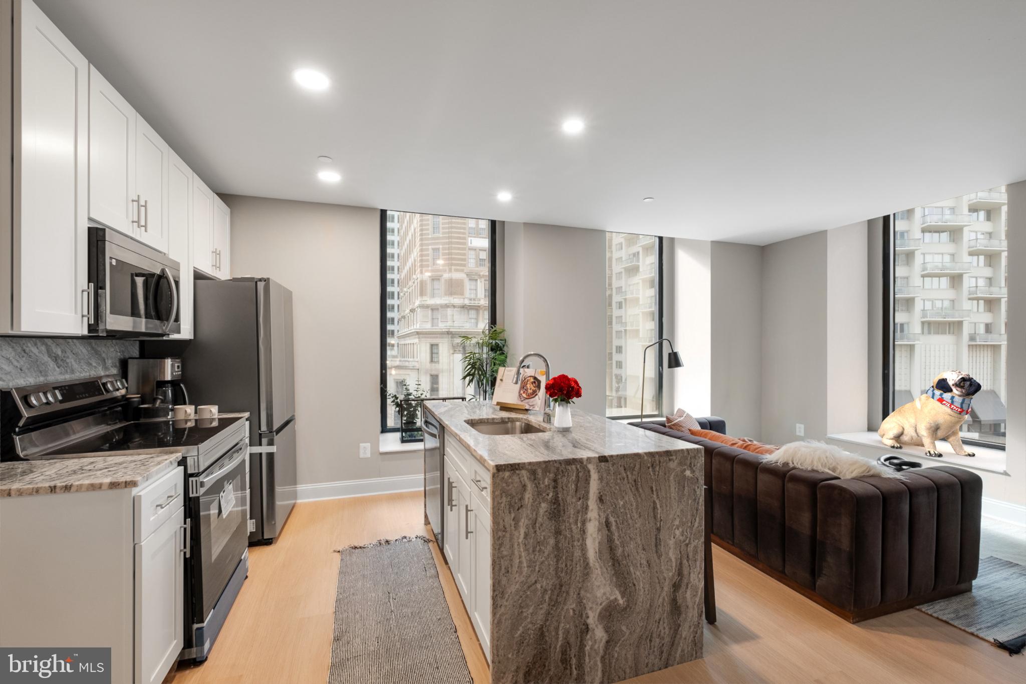 Experience elevated urban living in this exquisite 2-bedroom, 2-bath luxury apartment at Three Parkway. Thoughtfully designed with a seamless blend of elegance and functionality, the OPEN-CONCEPT living and dining area features a custom kitchen outfitted with STAINLESS STEEL APPLIANCES, SLEEK GRANITE COUNTERTOPS, AND A SPACIOUS BREAKFAST BAR—perfect for entertaining or casual meals. FLOOR-TO-CEILING WINDOWS flood the space with natural light, while each generously sized bedroom offers ample closet space. Both spa-inspired bathrooms showcase modern finishes and elegant tile work. Units feature HIGH CEILINGS, waterfall islands, IN-UNIT WASHER AND DRYER, HARDWOOD FLOORS, solar shades, and advanced air purification systems. Residents of this amenity-rich building enjoy access to a state-of-the-art FITNESS CENTER, stylish lounges—including entertainment areas on every floor—and conveniences such as an on-site café, pickup/dropoff zone, bike storage, and a 24/7 FRONT DESK with package acceptance. Located just minutes from Rittenhouse Square, the University of Pennsylvania, and Center City’s business district, this prime address also offers exceptional dining options like Sansom Street Oyster House, Harp & Crown, and Vernick Fish, along with easy access to green spaces such as Love Park and Logan Square. With proximity to top universities, schools (The University of Pennsylvania, Drexel University, Thomas Jefferson University, Moore College of Art & Design, and Friends Select), and seamless connections to public transit and major highways including I-76, I-95, and I-676, this residence offers the ultimate in convenience, style, and city sophistication. Schedule your tour today and discover why so many call this stunning community home. (Please note: Photos may include multiple model units.)