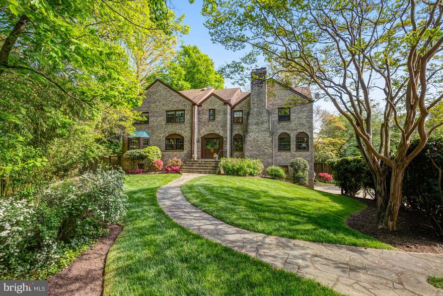Open Friday 4-6pm and Saturday 1-4pm!  Nestled within the highly sought after Chain Bridge Woods section of Chesterbrook Woods, this enchanting three-level colonial is just one stoplight to DC and exudes storybook elegance at every turn. Its exterior, a combination of brick with stone accents, invites you into a world of timeless elegance. A pitched roof, punctuated by arched windows, adds whimsy to the silhouette, while a wide welcoming front porch beckons you to step inside.

As you enter through the arched doorway, you're greeted by an interior that seamlessly blends classic colonial architecture with Tudor-inspired details. The foyer boasts gleaming hardwood floors that lead you toward the heart of the home. To your right, a large living room awaits, adorned with a brick fireplace framed by a wooden mantel, perfect for receiving guests or curling up with a good book on chilly evenings.

Across from the Living Room, the formal Dining Room offers an elegant space for gathering with loved ones. Sunlight filters through the large picture window, casting a warm glow over the hardwood floors and highlighting the intricate moldings that adorn the walls. 

The Kitchen combines modern amenities with old-world charm. Crisp white cabinetry, black and white tile flooring and stainless steel appliances create a bright and inviting atmosphere, while a dual corner sink and white solid surface countertops add practical appeal. A cozy breakfast nook nestled by a bay window provides the perfect spot to savor morning coffee and soak in views of the tranquil front yard.

A wide staircase descends from the Kitchen into the expansive Family Room with high ceilings.   Exposed wooden beams and an impressive floor-to-ceiling natural stone fireplace add character to the room, while oversized windows frame views of the serene outdoor landscape.  A sliding glass door leads to a picturesque patio and large flat fenced-in backyard with mature plantings. 

Upstairs, the charm continues with five generous bedrooms, all with hardwood floors and large windows, each offering its own ample layout. The master suite is accessed via a private hall and boasts a cozy sitting area with a wood burning fireplace and a large en-suite bath with dual vanities, private water closet, soaking tub and shower.  Four additional bedrooms and two full hall baths complete the Upper Level.

The lower level of the home offers even more living space.  This area with built-in bookshelves and a cozy fireplace is ideal for a recreation room, playroom, or home office .  A full bath, ample storage closets, direct access to the Garage and an unfinished storage area complete the Lower Level.
With its blend of timeless architecture, spacious interiors, and picturesque surroundings, this three-level brick colonial with storybook charm offers a truly magical place to call home.

Close to the Chain Bridge, Chesterbrook Shopping Center, Arlington, Downtown McLean, and Tysons.  Enjoy nearby hiking trails, parks, or a stroll through the neighborhood.  Close proximity to Reagan and Dulles airports.