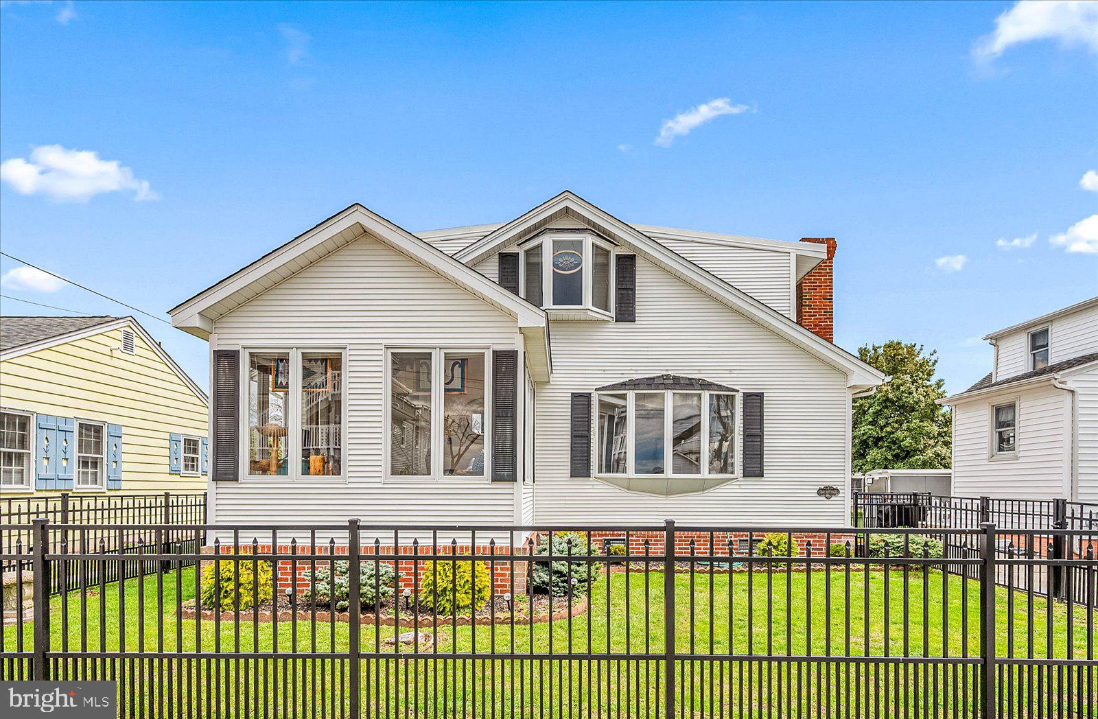 Have you ever walked along Edgewater Avenue and thought how great it would be to own one of the few quintessential Ocean City homes that have stood the test of time? This is your opportunity to be the steward of a piece of Downtown OC history. Located steps from the bay and 4 blocks to the beach, enjoy in-town living on the quiet bayside. Private fenced yard, off-street parking and views of the Isle of Wight Bay from every West facing window in the house. Original wood flooring and decorative ceilings throughout anchored by a stately brick fireplace in the front sitting room. Relax in the sunroom or on the South facing deck overlooking the yard. A unique feature is the guest cottage attached to the East end of the house with knotty pine interior walls and its own mini-split heat/air unit. You have to visit the property to experience the interior features and feel of this timeless home. Come take a look.