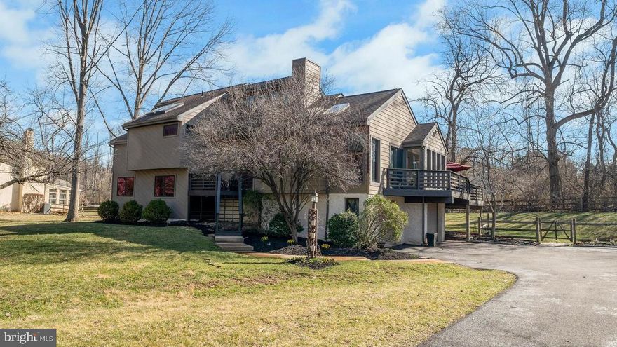 Secluded and serene in this location? Priceless! This contemporary home, with its large windows, cathedral ceilings, and unique angles, offers a private oasis in the midst of a busy area thriving with activity.  Nestled on a 1+ acre yard with complete privacy, this property is a true gem. Feel right at home as you enter the wide-open foyer that flows seamlessly into the spacious living room with a vaulted ceiling and gorgeous views from floor-to-ceiling windows. The kitchen boasts plenty of cabinet and counter space, making dishwashing a delight with lovely nature views from the corner windows. A peninsula offers more room for the home chef, and the kitchen opens to the formal dining area. The open living room features a cathedral ceiling and a stunning focal stone wall with a fireplace, perfect for cozy evenings. Here, you'll also find access to the large deck, making entertaining guests seamless. You can access this wrap around deck from the kitchen, dining area, or living room. Head upstairs to discover the oversized owner's suite with cathedral ceilings and large skylights.  This suite has a sitting area that can be used as a home office, TV room or nursery, a walk-in closet, and a full bath featuring a soaking tub, stall shower, and dual vanity. This suite also offers balcony access to another deck, adding to the grandeur of this home's wonderful design. The lower level has 2 bedrooms and a full bath.  Buyer to verify sq ft and acreage before purchase. Step down to yet another level to find a storage room and closet, which can be converted to a 4th bedroom. This area also has access to a 2-car garage. The basement is unfinished and has plenty of room for your storage needs. The seller has replaced the entire exterior siding trim and most of the windows.  Check seller's disclosure for other updates. Did we mention award winning Downingtown East schools with a highly acclaimed STEM Academy? Enjoy easy access to restaurants, golf courses, and major highways. With close proximity, you can walk to Bell Tavern Park, Wawa, Regal Cinema, Wegmans, Olive Garden, and more. This location combines convenience with a serene suburban lifestyle. Welcome Home!