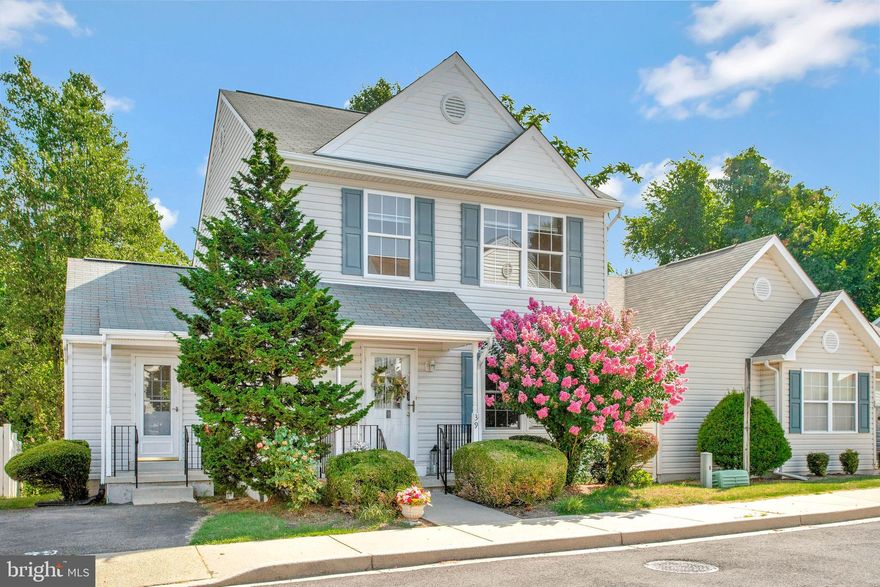 Are you looking for a well-cared for, updated, and MOVE-IN READY, 3 BEDROOM, 2.5  BATH, SINGLE FAMILY  home, with a great location, AND priced under $370,000? Would you like to enjoy your big backyard while the HOA MOWS THE GRASS for you? Then look no further!  Welcome to your lovely new home, with FRESHLY PAINTED walls, and beautiful, real HARDWOOD FLOORING  throughout the entire first floor! This surprisingly spacious home even offers TWO LIVING SPACES  so everyone can comfortably spread out! ***Walking in through the entry at the front porch, the living room greets you with a stylish accent wall and ELECTRIC FIREPLACE ***The adjacent dining area is large enough for entertaining and comes with the corner dining hutch that conveys  AND a charming BUILT-IN WALL HUTCH that adds character and a custom touch. *** You’ll be amazed at the size of the  HUGE, OPEN-CONCEPT KITCHEN with GORGEOUS, LIGHT-COLORED GRANITE countertops, designer tile backsplash, and BRAND NEW STAINLESS STEEL APPLIANCES! The  table-height CENTER ISLAND is great for comfortable  sit-down snacking and food preparation (and especially practical for kid chefs, too!) *** The adjacent  FAMILY ROOM has sliding glass doors opening to the BACK DECK, which offers BEAUTIFUL VIEWS  of the LARGE BACKYARD, and overlooks the picturesque grounds of the adjacent historical society property beyond. ***There is also a utililty nook off the family room, complete with half bath, laundry area with a NEW WASHER AND DRYER and another door leading to a secondary front porch! ***Going upstairs, you’ll appreciate the lovely MATCHING LAMINATE FLOORING thoughout this level. You’ll love the GENEROUSLY SIZED PRIMARY BEDROOM SUITE with its own bathroom and  a WALK-IN CLOSET! There are two other bedrooms and a  hall bathroom upstairs, as well. ***This home is part of a small  "VILLAGE STYLE" CLUSTER COMMUNITY  of single-family homes. The Sellers want you to know that the neighborhood is very friendly, too! This home is  conveniently located  NEAR THE HEART OF "DOWNSTOWN" Prince Frederick, and within  WALKING DISTANCE  to  stores, restaurants and businesses.  The Park-N-Ride lot is close-by, too!  The HOA fee not only covers trash and snow removal, but your LAWN MOWING as well! (NOTE: FENCES ARE ALLOWED, too, if desired!)  ***Schedule your tour today so you don’t miss out on the opportunity to make this great home your very own!