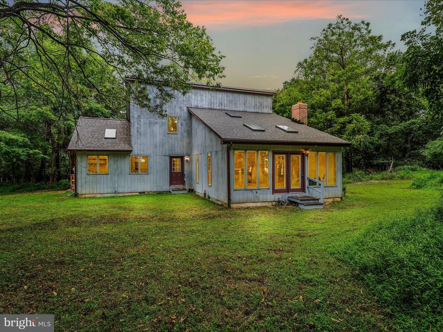 Welcome to your private retreat in Shepherdstown! Nestled on 2 acres with surrounding area being newly declared protected parkland. This contemporary home is filled with character and architectural charm. The layout features a main-level bedroom and an inviting design that blends beautifully with its natural surroundings.  NEW ROOF & NEW SKYLIGHTS in last couple of years.  Wildlife and privacy abound, creating the perfect setting for relaxation and inspiration. With endless potential to make it your own, this property is just minutes from historic Shepherdstown and all the rich history, culture, and amenities Jefferson County, WV, has to offer.