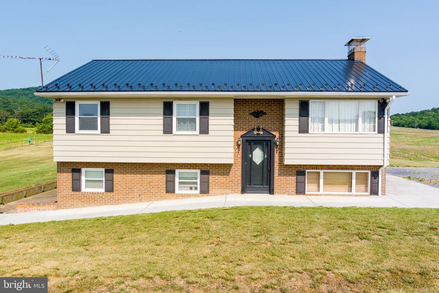 A 3 BDRM 2 BATH SPLIT FOYER ON APPROX. 2.5 ACRES,  BRAND NEW LIFETIME METAL ROOF, CENTRAL A/C, OIL HOT WATER HEAT,  WOOD STOVE IN BASEMENT, ALL APPLIANCES CONVEY,  LARGE REAR DECK, LARGE SIDE PATIO WHICH LEADS TO BASEMENT, QUIET COUNTRY SOLITUDE YET JUST MINS TO BANKING & SHOPPING.  LARGE DETACHED STORAGE BUILDING/WORKSHOP (15X36).  READY TO MOVE IN TODAY!