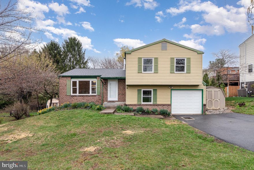 Welcome to this charming 3-bedroom, 1.5-bath split-level home in Rolling Ridge! Step inside to find a bright and inviting living room, perfect for relaxing or entertaining. The adjacent dining room features stylish laminate flooring, while the kitchen offers laminate flooring, abundant cabinetry, and generous counter space—ideal for meal prep and storage. A convenient half bath completes the main level.

Upstairs, the primary bedroom provides a comfortable retreat, along with two additional bedrooms and a full bath featuring a Jack-and-Jill sink. The lower level offers even more living space with a cozy family room and an office, currently used as a mudroom. Need extra storage? The basement provides plenty of room to keep everything organized.

Outside, enjoy the deck and backyard, perfect for entertaining or unwinding, along with a convenient storage shed. This home is move-in ready with an active radon system and a brand-new roof installed in 2023. A one-car garage adds convenience. A joy to own.