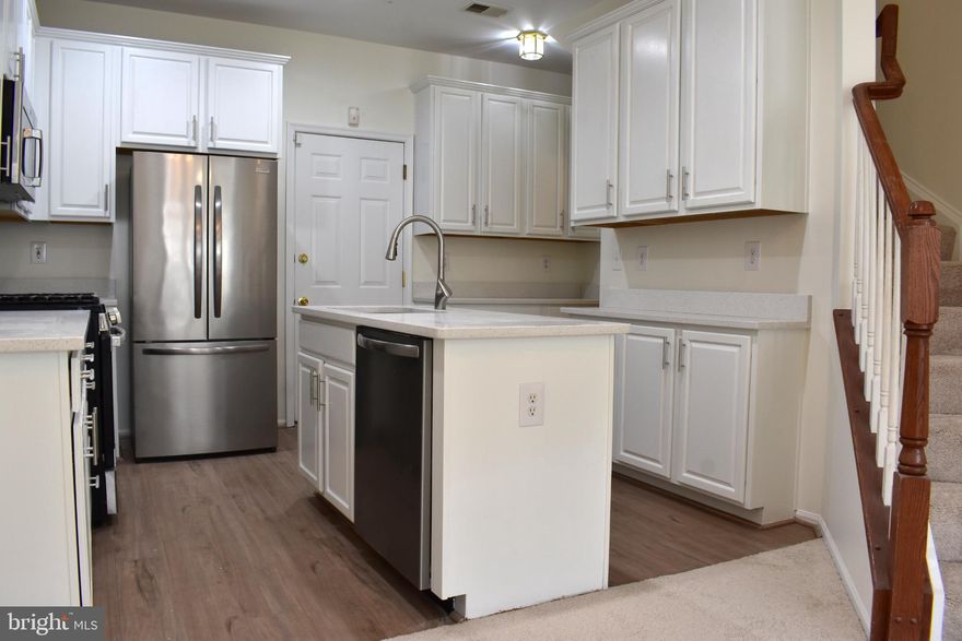 This charming townhouse style condo offers a perfect blend of comfort and modern living. Recently renovated and in move in condition, this retreat features three spacious bedrooms and two and a half bathrooms, designed with an open floor plan that invites warmth and connection. The interior boasts luxurious touches, including crown moldings, recessed lighting, and upgraded quartz countertops, while the primary suite features a walk-in closet and a spacious bathroom.  The kitchen is a chef's delight, equipped with stainless steel appliances, an island for meal prep, and a pantry for ample storage. Enjoy cozy evenings in the inviting living spaces adorned with plush carpeting and lots of natural lighting. Conveniently located less than a mile from bus and commuter rail stations, this home provides easy access to local amenities. Hurry over as this gem won't last!!!