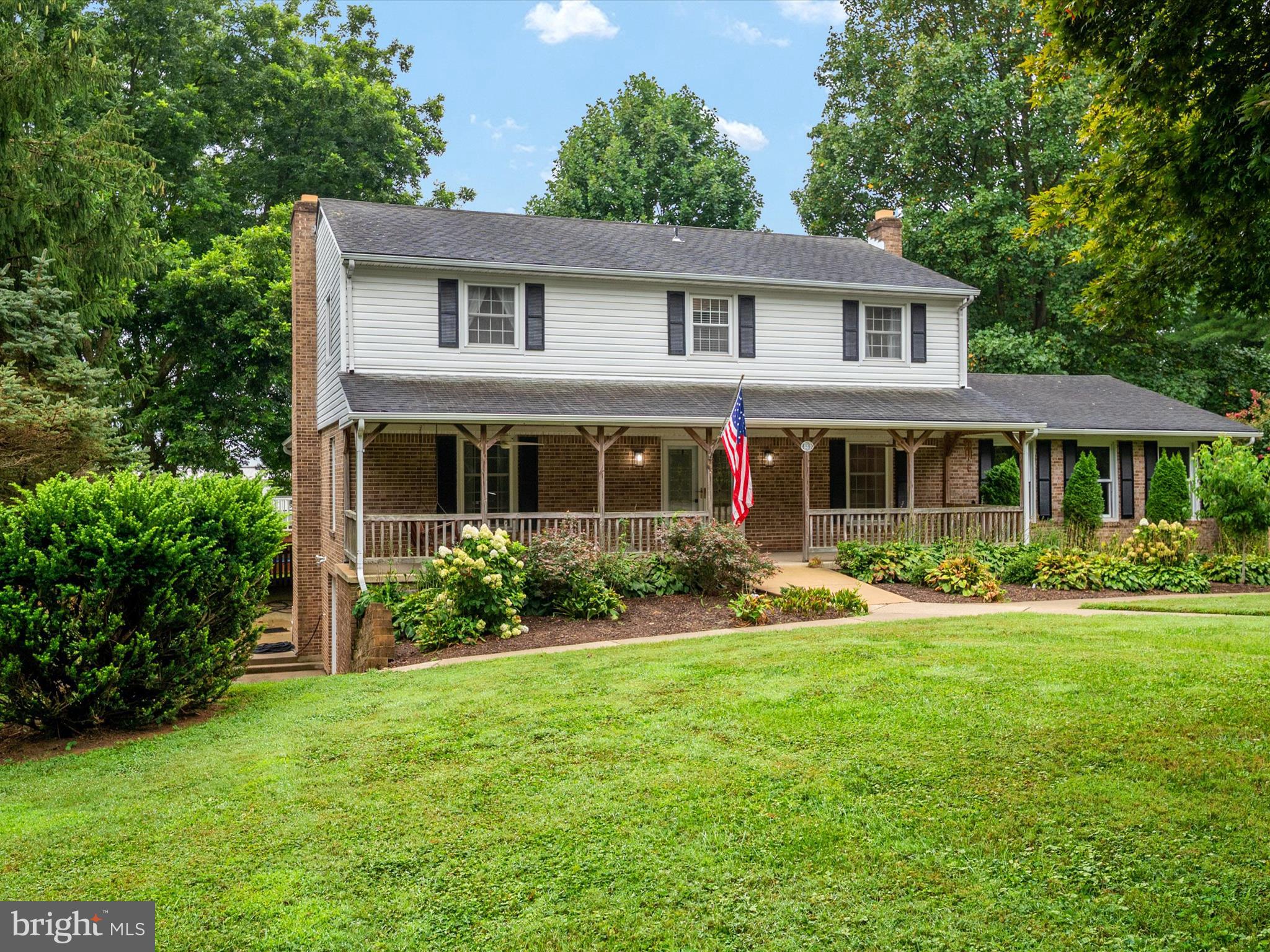 Great opportunity to own 4 acres with lovely 4 Bedroom 3.5 bath colonial with atttached two car side entry garage and a 30x60 Conestoga Custom barn in desired Western Howard County! Fully covered front porch to sit and enjoy the tranquil countryside, Home boasts an excellent floor plan that offers the living space to spread out within, Formal living room and dining rooms greet you as you enter the foyer, bright kitchen with counter space for preparing meals and pantry just off dining room and overlooks into as an oversized servery with cabinetry, sink and second dishwasher and breakfast room which is perfect for gatherings, hosting parties or holiday meals! Not only is there a main level family room with fireplace but you will find an additional main level rec room with a full bath attached with soaking tub, shower and double vanity, This could be ideal for someone seeking main level accessibility! You'll also find a laundry room on the main level and an half bath, Upstairs, you'll discover four generously sized bedrooms including the primary bedroom with private bath ensuite, The basement is ready for your finishing touches with fireplace and a walk out exit via French doors, The basement offers ample storage and has a second laundry hook up area, Off the back main level is a deck and patio perfect for grilling, dining or just relaxing and taking in the magnificent pastural view, Part of the yard just off the back of the house has firepit area and is fenced. The custom barn with concrete floor and upper loft offers opportunity for multiple uses. Conveniently located off the beaten path but close to major thoroughfares for easy commuting access and near desired services and amenities - Glenelg High School, Glenwood Middle and Lisbon Elementary school district!