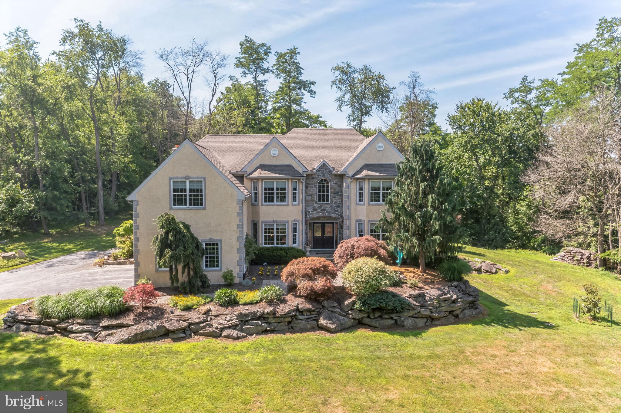 A Secluded Hilltop Estate Minutes from West Chester — Timeless Elegance Meets Modern Resort Living
Perched atop nearly 6 acres of rolling, tree-lined hillside, 1303 Lenape Road presents a rare opportunity to own a private estate of exceptional distinction — blending refined luxury, impeccable design, and effortless proximity to the cultural heart of West Chester.
Bathed in natural light and impeccably maintained, this 5-bedroom, 4.5-bathroom residence spans expansive interior spaces thoughtfully designed for both grand entertaining and intimate daily living. From the moment you enter the soaring foyer, you're met with an immediate sense of calm, sophistication, and craftsmanship.
Main Level Living: Designed for Entertaining & Everyday Luxury
At the heart of the home, the chef’s kitchen features top-tier Thermador and Kitchen Aid appliances, sleek surfaces, and a fluid layout that opens to formal and informal gathering spaces. French Doors transition seamlessly to the outdoor living area — perfect for evening cocktails or weekend brunch by the pool. Rich hardwood floors, oversized windows, and architectural ceilings frame views of the lush grounds and curated gardens.
Step down to the vaulted great room, where a dramatic wall of glass overlooks the resort-inspired pool and patio — a stunning backdrop for hosting or simply unwinding in style.
A Primary Suite Retreat
Upstairs, the spacious primary suite offers a sanctuary-like experience with its own sitting room, spa-inspired bath, custom walk-in closet, and a beautiful stone-accent feature wall. Each of the additional bedrooms is generously proportioned, with character-rich details and semi-private bath access.
Lower Level: Luxury Beyond Expectations
The finished walk-out lower level boasts soaring 9.5’ ceilings and elegant, bespoke finishes — including handcrafted doors, a second full bar, billiards lounge, steam shower, and ample space for fitness, media, hobbies, or multi-generational living. Every inch reflects quality and thoughtful design — even the utility/storage areas are immaculately organized. A whole-home Generac generator ensures continuous comfort and peace of mind.
Outdoor Oasis: Resort-Style Living Year-Round
Step outside into a private, fully landscaped paradise: a state-of-the-art heated pool, hot tub, and multiple lounging and dining areas set against a serene, wooded backdrop. Automated awnings and pool controls bring ease to al fresco entertaining. Thoughtful garden placements — from blooming florals to herb clusters — elevate both the beauty and functionality of the grounds.
Location: The Best of Both Worlds
While this property offers true seclusion and tranquility, it’s just minutes from the boutiques, restaurants, and historic charm of downtown West Chester. Enjoy quick access to Radley Run Golf & Country Club, Longwood Gardens, King of Prussia, and Philadelphia — placing world-class dining, recreation, and travel within easy reach.
________________________________________
This is more than a home — it’s a lifestyle estate.
For those who value privacy, elegance, and effortless luxury, 1303 Lenape Road is a one-of-a-kind opportunity. Schedule your private tour today.