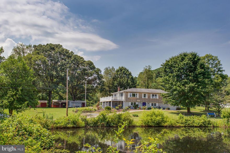 Welcome to your dream 5-acre farmette nestled in the charming Hughesville countryside! This exquisite property offers a multitude of possibilities, catering to your equestrian passions, entrepreneurial aspirations, or simply the desire for serene country living.

At the heart of this picturesque estate stands a remarkable nine-year-old horse barn, boasting three generously sized horse stalls and an additional space thoughtfully designed for hay storage. Convenience meets functionality with the inclusion of water and electric within the horse barn, ensuring your equine companions are always comfortable.

Five separate and spacious pasture areas have been meticulously crafted, allowing for effortless horse rotation and grazing. Rest easy knowing that the entire property is encompassed by an electric fence, providing both security and peace of mind. Gutters and guards installed 2021, and the home is ready for solar power. Almost totally off grid living so homesteading is a possibility.  Woods on either side with a  natural stream ensures that your neighbors will always be at a distance. 

A separate tool shed adjacent to the barn offers organized storage and easy access to your tools and equipment. For the angler in you, a private half-acre pond stocked with fish beckons, creating an idyllic setting for leisurely afternoons.

The circular driveway and abundant parking spaces effortlessly accommodate trailers, RVs, or any extra equipment you may have, ensuring that practicality meets beauty at every turn.

Step inside the spacious two-level home, where comfort and elegance merge seamlessly. With five bedrooms and three full baths, there's ample space for your family and guests. The main level boasts a newly remodeled kitchen adorned with granite countertops, stainless steel appliances, and a decorative backsplash, making culinary endeavors a delight.

The formal living room exudes warmth, featuring a wood-burning stove and custom-built cabinets and shelving that reflect timeless craftsmanship. A formal dining room with easy access to a sprawling deck provides the perfect backdrop for entertaining or enjoying tranquil evenings.

Indulge in luxury within the remodeled hall bathroom, complete with a jetted soaking tub and a step-in shower equipped with multiple showerheads and body sprays, all elegantly finished with designer glass tiles and a double sink vanity.

The owner's suite bedroom offers a private oasis, complete with a full bath, while three additional spacious bedrooms on the main level accommodate your family's needs with style and comfort.

Descend to the full finished walkout basement, where possibilities abound. A large open recreation room, fifth bedroom, full bath, and a convenient laundry area ensure that every need is met. The screened-in porch off the recreation room invites relaxation during the sunny months, offering a peaceful haven to unwind.

Completing this remarkable property is a charming chicken coop, inviting you to explore the joys of hobby farming.

Recent updates include a brand new air conditioning system in March 2023, replacement of septic drain fields in 2017, and the installation of a new electric circuit breaker box in 2022, ensuring modern comfort and reliability.

Located just a few miles from Oak Ridge Equestrian Park, your property harmoniously blends rural tranquility with easy access to equestrian pursuits. Embrace the lifestyle you've always envisioned – whether it's a haven for your horses, a thriving home-based business, or simply a sanctuary of natural beauty and endless possibilities. This is more than a property; it's an invitation to create your own legacy.