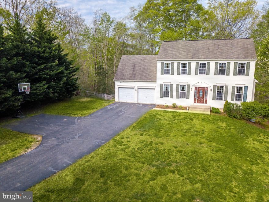 BIG BOLD BEAUTY! Spacious colonial with plenty of room to entertain and situated on a large private lot! Open kitchen features SS appliances, island, & recessed lighting....with doors to back deck. Family room with gas fireplace & formal dining room perfect for entertaining. Upper level boasts master suite w/ WIC, attached bath w/dual sinks, Jacuzzi jetted tub & separate shower, and 2 additional bedrooms w/shared hall bath. Finished basement with wet bar,  office/4th bedroom, and full bath. Doors off kitchen lead to screened porch and composite deck (with audio system). Fully fenced backyard gives you privacy and plenty of room to entertain, cookout, etc. 2 car garage with auto opener. The GEO Thermal HVAC and LED lighting reduce the electric bill each month. This home won't disappoint...schedule a showing today!