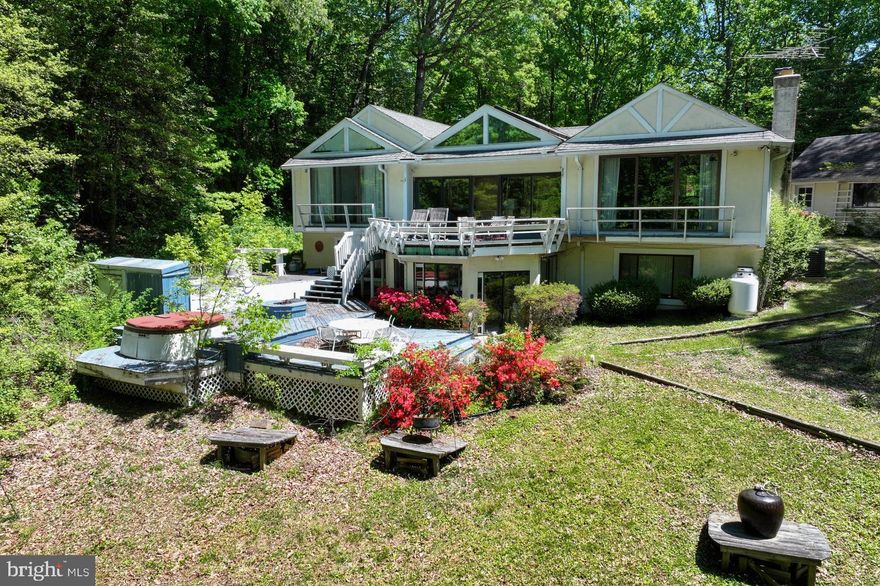 It's all about the land at this St. Margaret's Farm location with approximately 150 ft of Mill Creek waterfrontage. Home being sold in AS IS condition.