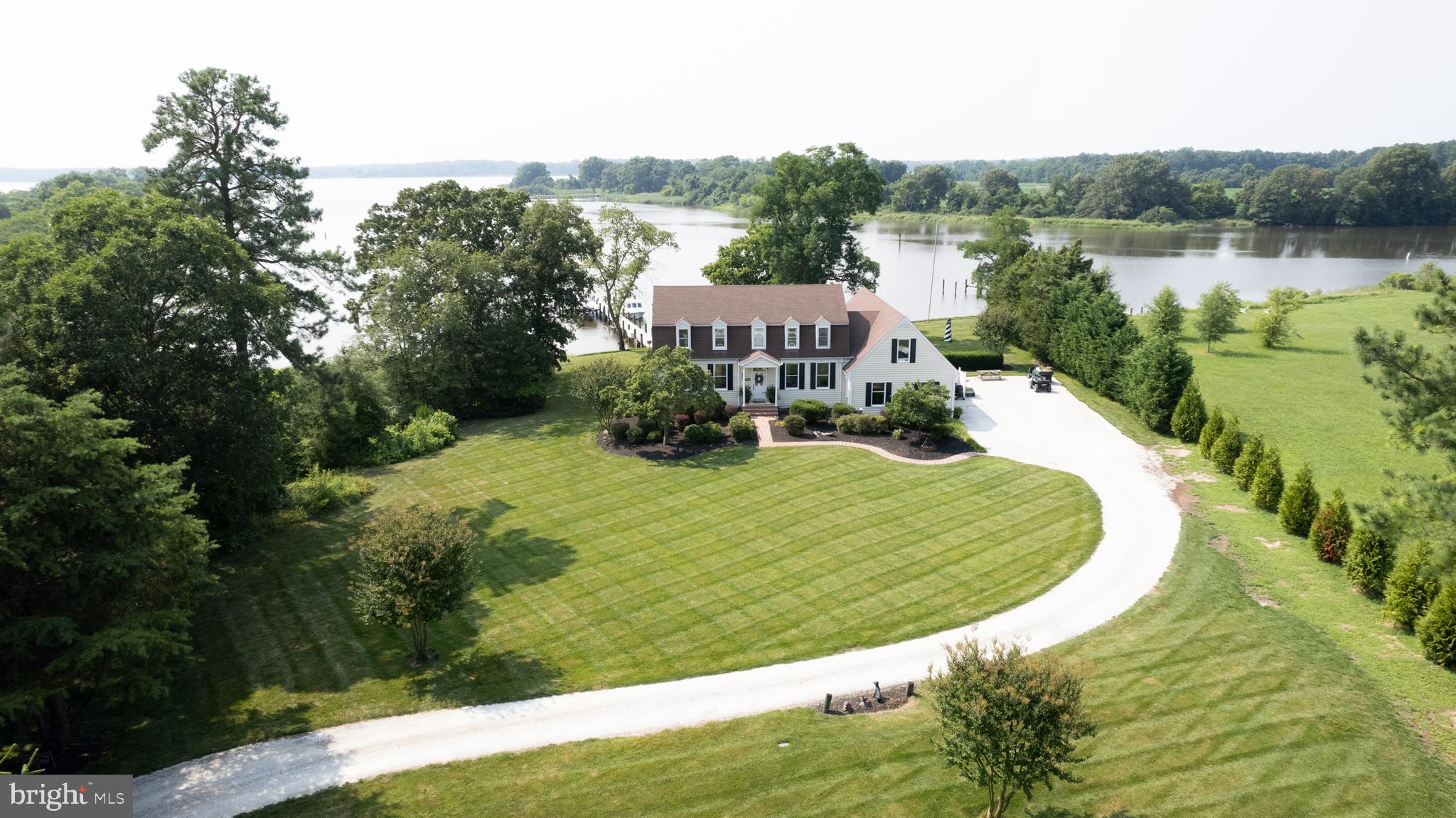 RARE - North Choptank River waterfront. You will be amazed by the exceptional water views offered from this home! Overlooking Cabin Creek with wide views out to the Choptank RIver. The land across from the property is protected and not developed. Eagles and osprey galore! Fully riprapped shoreline with new dock and boat lift. High lot with no flood insurance required.
The home feature two primary bedrooms (one on the first one on the second) with attached baths.
Brand new , upgraded shop -