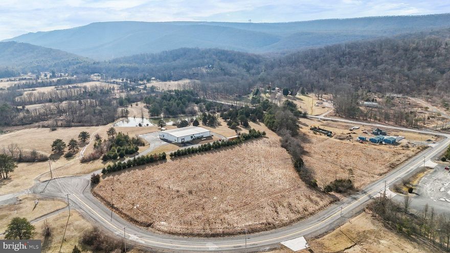 Discover a lucrative commercial land lot investment opportunity tailored for your business needs at 522 Industrial Park combining Lot 8 (3.07 acres) and Lot 9 (3.36 acres). Located near Historic Berkeley Springs and Great Cacapon State Park, this property boasts high visibility and significant traffic flow. See Covenants & Restrictions in Documents