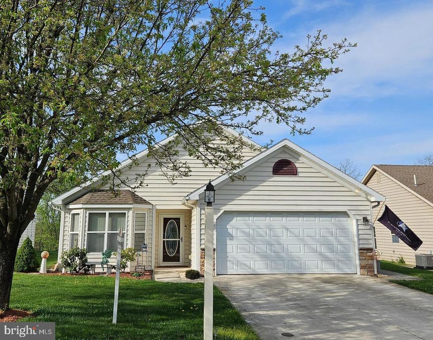 The one you have been waiting for!  This spacious and lovely single family stick built home in Country Manor is well maintained and move in ready.  With 1705 finished square feet this home has more space than most and it's pleasant floorplan boasts 3 bedrooms, 2 full baths, an eat in kitchen with pretty cabinets and space above to show off your collection of...whatever!   There is a formal dining area that opens to the living room (this owner has removable screens creating an office space in the dining area)  The stone fireplace (gas) is so pleasing as is the large primary bedroom with big bathroom.  You will love the year round sunroom and rear deck overlooking the meadow common area (maintained by the hoa). The garage is more than adequate to house 2 vehicles with extra space for storage or room to putz. The laundry room is big and spacious, too! This exceptional home is located in Shippensburg's premier 55+ community!  The HOA fee for Country Manor includes sewer and trash and access to a fantastic clubhouse featuring an elegant, open concept with a full kitchen, lounging area with fireplace and dining hall.  There are extensive wood bookshelves brimming with titles for hours of enjoyment.  A monthly calendar offers fun events like bingo.  Group trips are often planned, too!  There is a separate workout area available for a small additional monthly fee.  In the summer months the fishpond (catch and release) and gazebo are popular spots and there are outdoor games available such as bocce ball and corn hole!  Two dog parks, walking paths and benches complement the common space.
A lovely home in a vital, carefully planned gated 55+ community...Your future looks golden!