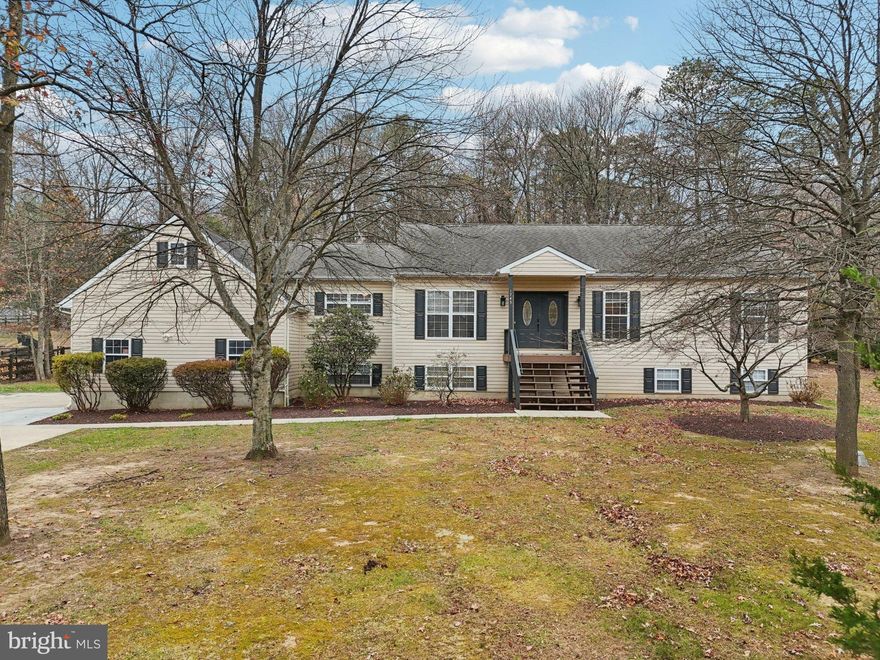 Appraised and ready for its new owners! Traditional comfort with modern charm is what you'll find in this over 3,700 total square foot home sitting on 1.36 acres. The inviting stairway leads you to the double door entry where the warmth of home greets you. The large foyer leads you into the living room with access to the elongated deck. To your left, the modern kitchen dares you to make the meals of your Pinterest dreams and serve them in your formal dining room. Down the hall, three of the home's five bedrooms including the Owner's Suite featuring three closets and deck access awaits. Enter the en suite bathroom to find the deep soaking jet tub, beautiful dual vanity and elegant standing shower. The large second bedroom features its own en suite bathroom ensemble. The third bedroom and full bathroom complete the main level's attractions. The basement serves as the home beneath the home with a large living area, two additional large bedrooms, ample storage space, separate laundry, a game room, and a gorgeous full bathroom for the family to claim. The oversized garage is a car show waiting to happen. Sitting on over an acre lot, this property is the gem it thinks it is. Schedule your tour today!