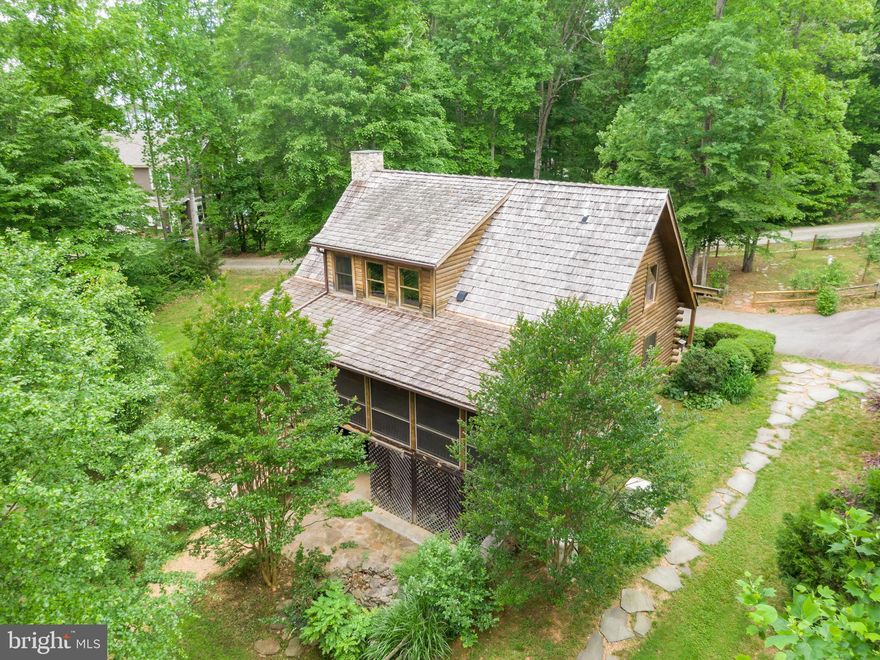 180 degree view of Lake Anna (public side) from your personal dock all year round!  Log homes have a uniqueness about them you can't find in typical homes.  The smell, the look, the warmth of them embodies what it is to live on the lake.  Live here all year round or this property would make a great investment property/Air BnB with income potential.  Property to be conveyed only by special warranty deed.