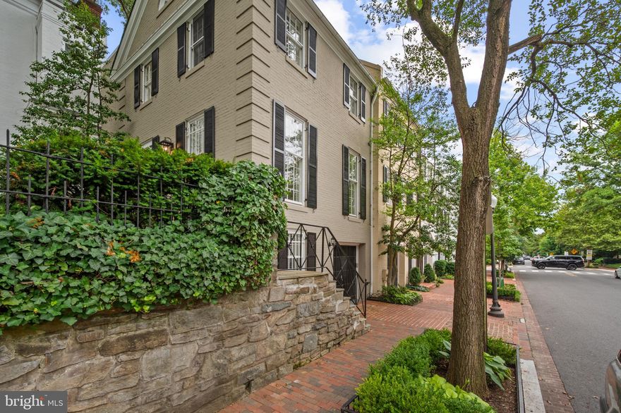 GEORGETOWN (West Village) - Standing tall at the edge of R St, overlook southern views of the city from this elegant three-level home with, 4 bedrooms, 3.5 bathrooms, an ELEVATOR and GARAGE parking. All covering just over 3,300 square feet the home has been meticulously maintained carrying bespoke architectural detailing and several modern updates. 

Main level encompasses an updated kitchen, half-bathroom, formal dining room (pictured here as a sitting room) with a trio of floor-to-ceiling windows to fill the room with natural light. Just down the hall find the formal living room with a gorgeous south-facing, sun-filled bay window. 

The gas fireplace (could be converted back to wood-burning), the high-ceilings, and the adjacent sun-room/study are just a few of the features that make this home both cozy and functional.

Adjacent sunroom/study with built-ins is quite peaceful and leads to the expansive garden oasis adorned with custom slate patio, working water fountain, and a double-tiered seating area. The perfect space for entertaining with room for a fire pit.

Upper 1 level carefully configures a total of 3 bedrooms and 2 full-bathrooms. Two large bedrooms with deep and wide closets and a hall bathroom, plus the owners quarters with an ensuite bathroom and two walk-in closets. Primary suite with treetop views.

The lower-level features one bedroom, a full-bathroom as well as the laundry room and entrance from the garage. Large pockets of storage throughout the home. 

In the heart of Georgetown, 2 blocks from Dumbarton Oaks. Montrose Park & Volta Park, shops, restaurants (Bistro Lepic just 400 feet away!), grocery, Georgetown Farmers market all close by and so much more.