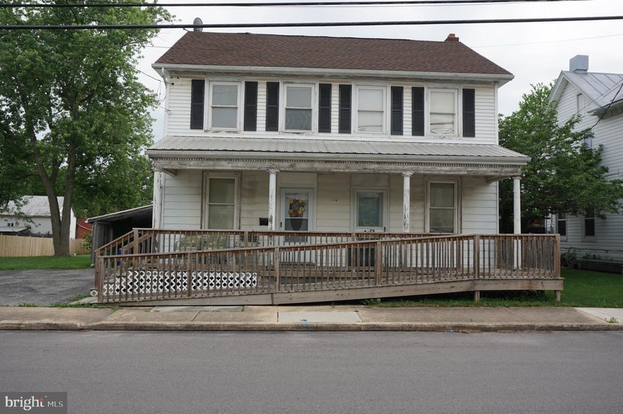 Great Opportunity and Investment.  This Home has some very nice features including a nice Family Room with Vaulted Ceiling , Wood Stove and French Doors leading to Rear Deck.  The home features 3,4 or more bedrooms, 2 Baths.  The Roof appears to be updated.  Vinyl Replacement Windows.  The nice double wide level lot leads to a really nice oversized 4 car garage and an additional barn that is currently rented on a month to month basis.  The Home does need to be Remodeled but there can be a lot of equity to be gained.