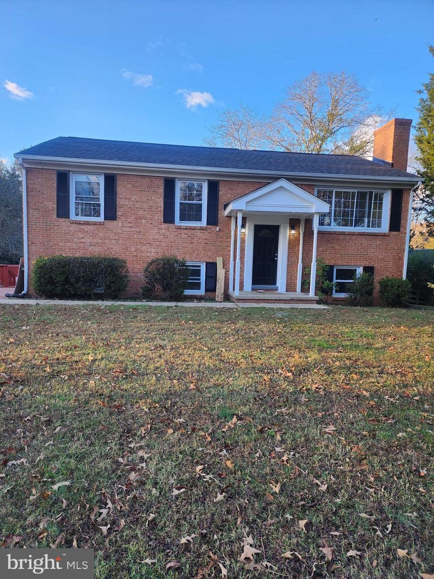 This is a beautiful brick home  that has been fully renovated from head to toe.  This house is about 10 mins from Charlottesville.  This is not your average home with 2,000 sq ft.  No, this home is over 3,700 sq ft. The renovations on this home includes a newly installed roof, refinished hard wood floors, updated patio deck, updated plumbing  that includes new connect.  All bathrooms have been updated.  The master bathroom upstairs and basement bathroom have been fully updated (new toilet, vanity, bathtub, flooring, etc).  The upstairs hallway bathroom has been partially updated.  This kitchen is so large and has been fully updated, cabinets have been painted with new hardware. The cabinets have new granite countertops  with a light color flooring to blend in with cabinets, backsplash, and countertop.  It also features another room outside the kitchen could be a great room or another potential bedroom without a closet. There is a large basement level suite large size bedroom and private living room area that also includes a walkout feature.  Also in this fully finished basement is a recreation/living room area. It's also another potential bedroom.  The is big home filled with lots of rooms is also sitting on a flat lot with excepts to driveway.  It's also in a peaceful quiet neighborhood that would be enjoyed by the right buyer.