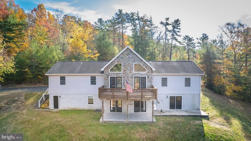 Experience the ultimate in mountain living with this stunning 3-bedroom, 3-bath home that boasts phenomenal 360-degree views! Step inside to discover a spacious layout perfect for entertaining, with huge windows that capture the amazing views from every angle. The expansive porches provide breathtaking vistas that invite you to relax and take in the beauty of nature from the comfort of your home. Nestled on a secluded lot, this property features a well maintained paved large driveway for your convenience. The finished basement includes a generous bar area, ideal for gatherings, along with a spacious 2-car garage. Whether you're searching for a forever home or a lucrative short-term rental investment, this property is sure to impress!