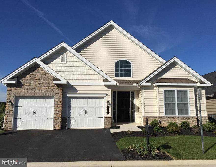 Located ONE BLOCK from the Clubhouse, this Franklin Model ranch was purchased last year for $460,617. The seller added many desirable (and costly) options (see Documents Section for list) to this home including wheelchair accessibility and a 12'x12' sunroom that opens to a 10'x16' deck. The gourmet upgraded kitchen layout has 42'' wall cabinets, quartz countertops, wall oven, base cabinets with pull-out trays and SS Kitchen Aid appliances. Why build new, wait 5 months and pay more!