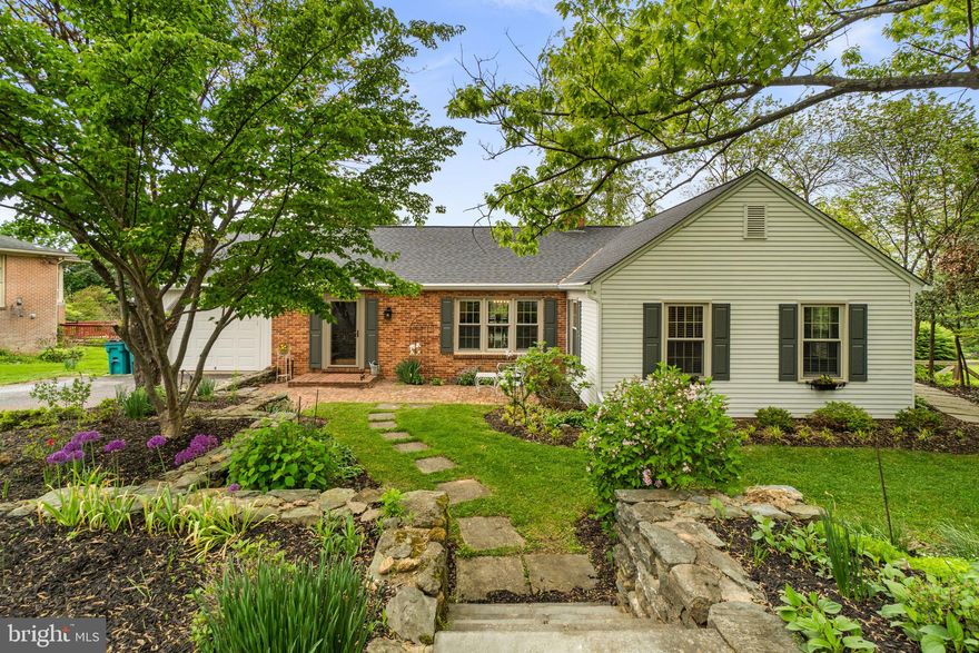 Welcome to this beautifully updated mid-century rancher, perfectly situated on a private and picturesque .73-acre lot in Westminster! Offering over 3,000 finished square feet, this spacious home blends timeless character with thoughtful modern updates and versatile living.

From the moment you enter, you’re greeted by a charming foyer with classic brick flooring, setting the tone for the home’s distinctive style. Inside, you’ll find a warm and inviting layout featuring hardwood floors, wide hallways, multiple living spaces, and three cozy fireplaces. The updated kitchen is a standout, boasting quartz countertops, stainless steel appliances, and a unique Dutch door, adding both charm and functionality.

This home offers true flexibility with 4 bedrooms and 2.5 baths, including a fully finished lower level with a second kitchen/kitchenette—ideal for in-law potential, guest space, or extended living. Convenient laundry is available on both the main level and lower level, adding everyday ease and functionality. Recent updates include fresh paint, exterior improvements, renovated basement fixtures, and newer basement windows.

Enjoy seamless indoor-outdoor living with a standout screened-in porch featuring one of the home’s three fireplaces—creating a cozy, year-round retreat. The porch also includes a versatile removable panel system that can be installed to enclose the space or stored when you want an open-air feel, offering flexibility for every season. Additional highlights include dual attic access (both pull-down and stair entry), providing excellent storage and convenience.

Step outside to a serene, park-like setting with extensive hardscaping, including a beautiful stone walkway and stone retaining walls, all backing to trees for added privacy. A cherry wood-paneled sunroom provides yet another inviting space to relax and take in the peaceful surroundings.

With its blend of mid-century charm, modern updates, and thoughtful design features, this one-of-a-kind home is truly a must-see!