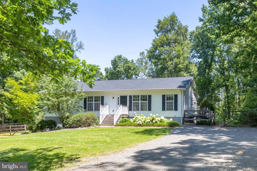 Welcome to this well-maintained 3-bedroom, 2-bath home nestled in the desirable Malvern of Madison community. Recent improvements make this home move-in ready, including beautifully refinished real hardwood floors and freshly painted interiors. Key updates include a new roof (2021), new water pump (2022), new hot water heater (2024), and new basement ductwork for heating and cooling. The main level features an open floor plan with hardwood flooring flowing through the living, dining, and kitchen areas, continuing down the hallway to the three carpeted bedrooms. The versatile layout allows for flexible use of living and dining spaces to suit your lifestyle. The primary bedroom offers a private attached bath with tile floors. Downstairs, the 728 sq ft finished lower level—with brand new carpeting—makes a perfect family room, media area, or playroom. The unfinished side of the basement provides ample space for a workshop, gym, or storage and includes a washer and dryer that convey. Enjoy the peace and privacy of a yard surrounded by woods, secluding it from neighboring homes. The fenced backyard is a gardener’s dream, featuring a mature Concord grapevine, space for a garden, and a variety of berry bushes and fruit trees. The property backs to over 100 acres of recently timbered forest, adding to the sense of space and solitude. As a resident of Malvern, you’ll have access to a range of community amenities including an outdoor pool, clubhouse, playground, lake, and miles of paved private roads—ideal for walking or biking. If you’re seeking tranquility, space in a convenient well-established neighborhood, this is the home for you. Comcast Internet