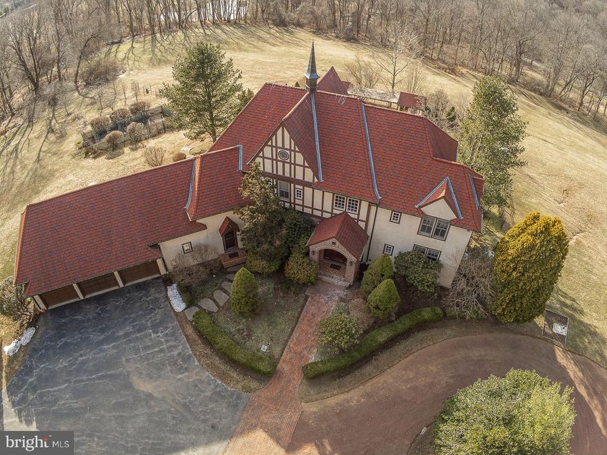 Welcome to "Belmeade".  This Peter Batchelor custom built Country Manor Home with approx. 6,000 square feet of living space is located at the end of a very special cul de sac street with a long history!  This 6 Bedroom, 5.5 Bath stately Home on the most private 15.2 acres awaits your visit.  As you head up the long winding driveway to this Home it fills you with a sense of peace with gorgeous views from every angle.  Enter the Foyer and feel right at home.  On one side of the foyer you will find a Bedroom with en-suite Bath and on the other is the Dining Room with hardwood flooring.  Hardwoods flow into the Great Room with an abundance of windows to show off the spectacular views.  The spacious Library has built-in bookshelves and is a great place to work from home!  The spacious and bright Eat in Kitchen with Breakfast Room has brand new hardwood flooring, 2 tier island, professional grade double stove/oven, 2 sinks, insta-hot water and a gas fireplace.  Completing the Main Floor is the Powder Room, Laundry Room with dog wash area and Mud Room with access to the 3+ car HEATED Garage!  Upstairs you will find the Main Bedroom with walk in closet and en-suite Bath, Princess Bedroom with en-suite Bath, 2 additional Bedrooms, full Hall Bath with jacuzzi tub, a Sitting Room PLUS another Bonus Room/6th Bedroom with access to the first attic area with electric and plumbing!   Another level up is the 2nd attic, great for storage!  The WALK OUT finished Lower level is simply amazing – with a huge Rec Room plumbed for a wet bar, large Gym with steam room, full Bath, wine room, large Pantry, utility room and exit out to the fenced in paver patio and inground Pool!  Move outside and find the most private and tranquil setting.  Sit on the Patio and relax, take a swim in the Pool, tend to the garden (fenced & trenched), pick fruit from your own Orchard (apples, pears and peaches), play horseshoes or just take in the scenery which is protected and can never be changed! A few more features to note on this wonderful home: whole house generator, 3 zone HVAC with I wave purification, CAT 5 wiring, 400 AMP service and so much more!  Deed allows for one (1) 1,200 sq. ft. guest house PLUS barn or other nonresidential outbuildings.  The community of Pine Creek consists of 24 home sites on 235 acres which are part of a 450+ acre deed restricted neighborhood of woods, ponds, streams, meadows and a horse trail. There are walking trails set aside in the neighborhood that connect to historic Horseshoe Trail, all perfectly located close to major highways, restaurants and shopping. Award winning Downingtown School District!   A wonderful Home in a very special location!  Take the Matterport tour at https://my.matterport.com/show/?m=KY67fTLV3Yq