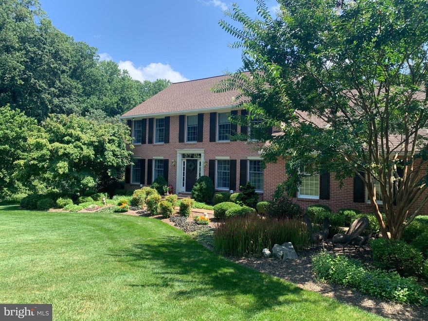 **Open House CANCELLED ON SAT, 8/28 **  This gorgeous brick colonial is a great a place to call HOME! Situated at the end of a quiet cul de sac in well established Phoenix community, this home rests on a spectacular two acre manicured  lot with lush landscaping, established trees, stunning views & privacy.  The tranquil setting provides an amazing backdrop for entertainment on the back deck, patio & yard.  Enjoy nature as you meander through the woods & stream located along the edge of the property.  As you enter the home you will notice the meticulous care given by the current owners.  The main level offers a traditional floor plan with separate living & dining rooms,  office, half bath & spacious kitchen with island & breakfast area opening  to a  family room with vaulted ceiling & floor to ceiling brick fireplace.   A bonus mudroom is located off the 2 car side load garage.  Amenities include hardwood  flooring throughout main level, crown molding, built-ins, granite countertops & fresh paint throughout.  The upper level showcases a primary suite complete with a sitting area, walk in closet with laundry area, and a stunning newly renovated bath.  Three additional bedrooms coupled with a beautifully renovated hall bath completed this level.  The lower level offers a walk out level to rear yard & is tastefully finished with a newly added full bath, spacious rec room with wet bar for entertaining,  a versatile area/possible bedroom along with a spacious storage area.