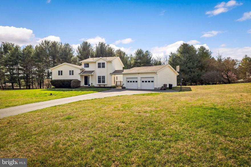 Welcome to your new home at 6 Hounds Hollow Court... Nestled in the coveted neighborhood in Owings Mills. Featuring beautiful landscape with lots of space, new driveway, along with 2 car detached garage.  Upon entering this home, you will notice freshly painted walls, porcelain tile and hardwood flooring. Beautiful open layout, with a chef's paradise gourmet kitchen, featuring center cooking island, quartz countertops, decorative tiled backsplash, stainless steel appliances, recessed lighting, wine refrigerator, double convection oven, warming drawer and a cozy casual dining area. Relax by the fireplace in the lower level, where there is an extra bedroom / gym with a half bath. As you make yourself to the second level, there are three bedrooms with two full baths. Upstairs, the gracious primary suite awaits, featuring an oversized walk-in closet with built-in shelves and pocket doors.  Relax in the jacuzzi in the pleasant primary bath. The primary suite also offers a gas fireplace for a quiet evening with your loved one. Outside, the rear deck provides the perfect spot to watch the sun rise and set. Don't miss this chance to make this phenomenal property your new home today!