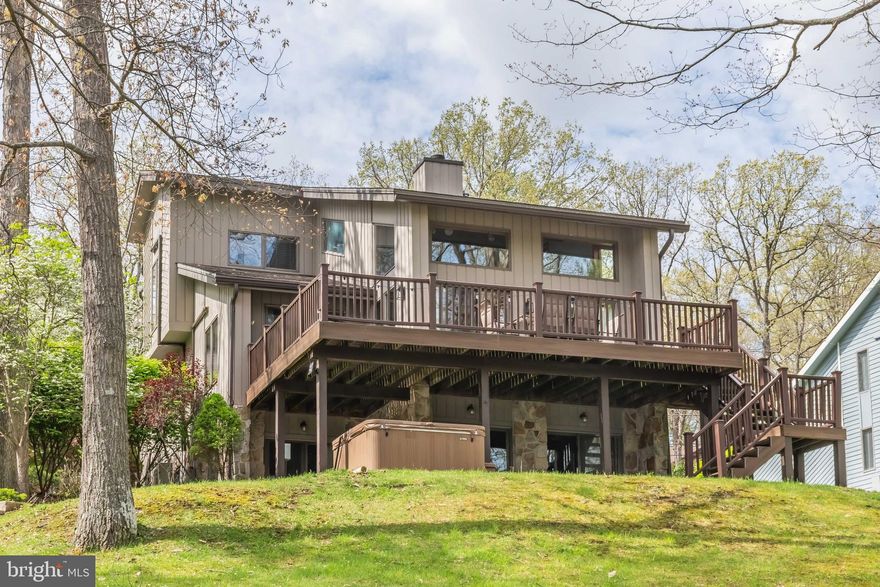 Very well-maintained lakefront home in the Echos community. This home offers stunning lake views from all levels and almost every room. The three levels of living space, a wood burning fireplace, granite countertops and four bedrooms are all great features for a full-time residence or vacation rental. The outside space is ideal for entertaining, featuring a nice sized Trex lakefront deck and a lower patio with a hot tub. Your Type A dock is just a few steps away, allowing you all the fun you would like to have on Deep Creek Lake. The paved driveway and attached garage are just a few more pluses to this property. Central location – close to DCL State Park, restaurants, cinema, grocery stores, and Wisp Ski Resort. Call today to preview!