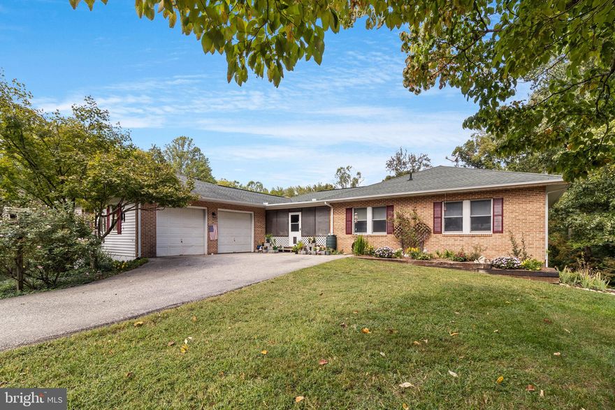 Welcome to your dream home! This stunning 6-bedroom, 3-bathroom rambler is nestled on 7.89 acres of pure privacy, offering the ultimate blend of comfort and adventure. As you step onto the spacious screened front porch, picture yourself sipping morning coffee while enjoying the peaceful surroundings.

The main level features a foyer with fresh paint throughout most of the upstairs, highlighting 3 bedrooms, including a primary bedroom with an en-suite full bath. Need a home office? You’ve got the perfect space for it on the main floor. The kitchen boasts a dining area and bar top, ideal for entertaining, Off the kitchen there is another sitting area with a fireplace that opens to a cozy living room for those gatherings and relaxed evenings.  Just off the living room, step out onto the deck with an awning overlooking the pool and backyard, perfect for outdoor dining or lounging.

The finished basement offers 3 additional bedrooms, a family room perfect for entertaining, a full bathroom, a convenient laundry room, a kitchenette, and even a wine cellar. Plus, an unfinished area provides plenty of storage space. From the basement, walk out to your own in-ground pool, concrete patio, and hot tub, where summer days are just waiting to be enjoyed.

Nature lovers, take a stroll down a wooded path to a private area by the stream—ideal for pitching a tent and soaking in the serenity.  This property also includes a greenhouse, a garden, grape vines, a chicken coop, a playhouse, and detached solar panels, making this the perfect all in one living.  This home has a newer 2019 roof.  Plenty of parking with a carport and an attached 2-car garage.

With a paved driveway and privacy to spare, this property offers the lifestyle you've been dreaming of. Don’t miss out—schedule your tour today!