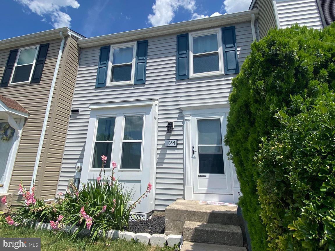 Welcome to 24 Burbage Ct, in the heart of Nottingham, close to all shopping, dining, and easy access to 43, 695, and I-95. This well maintained home is one of the larger units in the community, with a total of 1680 sqft, including a finished basement with full bathroom, previously used as a 3rd bedroom primary suite, with walkout patio, and fully fenced back yard. Upon entering the home, there is a newly renovated powder room (2024), and an eat-in kitchen with a breakfast nook for a small table. The kitchen has an open view of the living room with hardwood floors, a wood burning fireplace, and a slider leading to a new deck (2018). Upstairs you’ll find two generously sized bedrooms with modern open closet built-in systems, and an additional full bathroom. New Roof (2018), New siding (2020), and fresh paint (2024), this house is move-in ready, awaiting its new homeowners in the Perry Hall school district!
