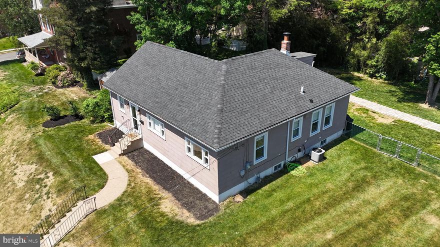Beautifully Remodeled Ranch in Rockledge Borough | Tucked into a quiet, tree-lined street just outside of Jenkintown borough, this updated 3-bed, 1.5-bath home sits within the highly-regarded Abington School District. Step inside to an open, light-filled main level with matching wood flooring throughout, where the stunning kitchen anchors the home. White shaker cabinetry, granite countertops, subway tile backsplash, stainless steel appliances, brushed gold fixtures, and dual peninsulas perfect for casual seating and entertaining. The main floor offers three well-proportioned bedrooms filled with natural light and a fully renovated bathroom with designer tile work. Downstairs, the fully finished basement adds over 550 square feet of flexible living space featuring a built-in bar area, recessed lighting, a convenient half bath, and washer/dryer hookups — ideal as a family room, media space, or entertaining lounge. Outside, enjoy a generous 0.29-acre on a wide lot, a detached two-car garage, and driveway parking for up to five additional vehicles when it's time to gather. Major updates include a newer architectural shingle roof, replacement windows, central A/C, 200-amp electrical service as of 2020. Move-in ready with nothing left to do — schedule your private showing today!