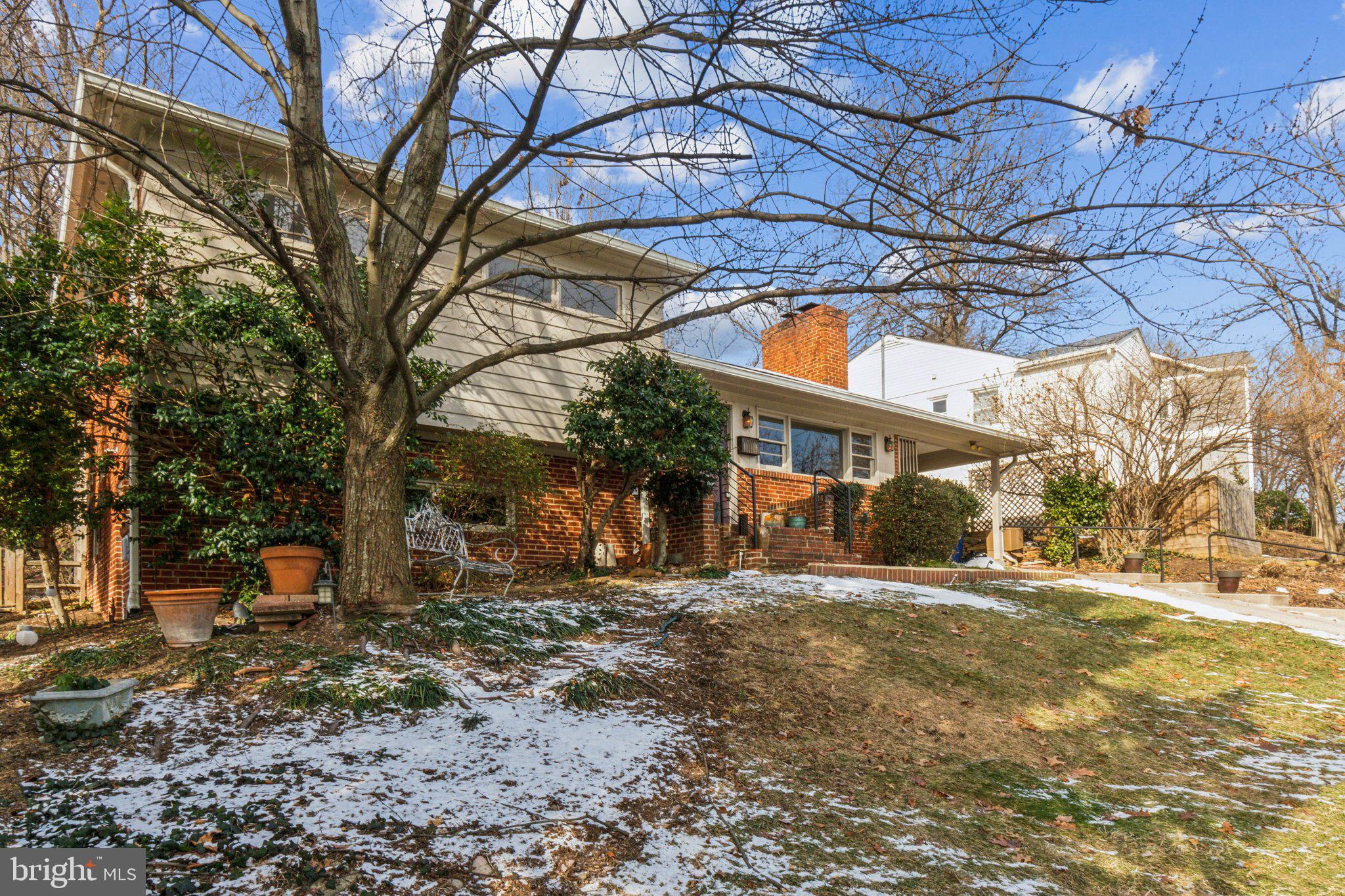 DEEPLY DISCOUNTED - $52k below assessed value! 2924 S. Grant sits perched above the street with views south and east towards Alexandria and the Crystal City skyline on a large 7,883sf lot. Driveway parking and a covered carport with walkway to front porch, as well as side entry through carport. Inviting front porch leads into the home where you are greeted by gleaming hardwood floors and abundant natural light and a convenient coat closet. Circular floor plan on the main level includes open sight lines from the living room through the dining room and out through the sliding glass doors to the screened porch. Living room features a gas fireplace with wood mantle and large east-facing picture frame window letting in abundant morning light. Tastefully appointed kitchen includes abundant wood cabinetry, white quartz countertops, under cabinet task lighting, hexagon tile backsplash and stainless-steel gas range. Upper-level features three generous bedrooms with plenty of natural light and generous closet space. Primary bedroom features a ceiling fan, large closet and mirrored closet doors and overlooks the backyard. Lower level boasts a large family room/ rec room, new LVP flooring including radiant floor heat, the fourth bedroom and the second full bathroom and separate side entrance. Lowest level is unfinished with excellent head height, includes utilities, abundant storage, second full size refrigerator, workshop space and laundry area with large wash sink. Whole home has been freshly painted in neutral tones, including ceilings, walls and trim, and numerous light fixtures have been recently replaced. Screened porch features vaulted ceilings with beadboard, elegant, exposed post framing, recessed lighting and ceiling fans and overlooks the backyard with access to the hot tub. Screened porch steps out to the back deck with hot tub and includes covered pergola and lattice for additional privacy. The mostly fenced backyard is a private oasis, with mature trees and plenty of wildlife, backing to Fort Scott Park. Supreme location within the most convenient neighborhood throughout the entire D.M.V. – Zero stoplights to Washington D.C., close to Metro, schools, shopping, dining and grocery stores including Whole Foods. Easy access to The Pentagon, Amazon’s new National Landing HQ2 Headquarters, Virginia Tech Innovation Campus, proximity to I-395 and much more!