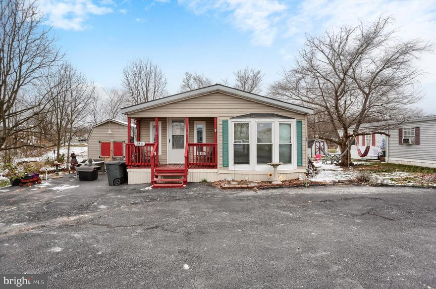 Welcome Home to this great double wide situated in a 55+ community and is at the end of Reo, which allows the use of the large yard, privacy and creek! Home has many major upgrades with a new roof,  windows, water heater, Heating & C/A, Bath and an updated Kitchen.  Offers 2 Bedrooms, 2 full baths, Lg Kitchen with all appliances/oak cabinets and lg pantry, Dining area w/views, open Living room, a Office/Den or a 3rd BR, Vaulted ceilings, ceiling fans, 200 AMP service, front & side porchs, nice Shed, a parking/patio area where you could have a patio table and chairs or use for parking. Don't miss this opportunity to own an affordable home in Hershey Estates aka Oliver Court! Must be park approved! NOTE: Hershey Estates pays the land tax!