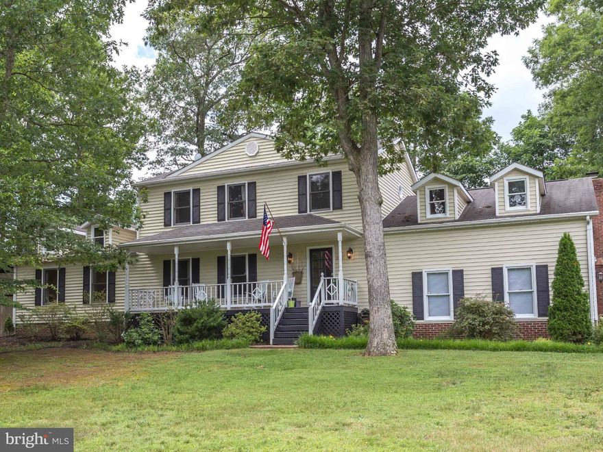 4BR/3.5BA 2588 Sqft. 2 Master Bedrooms. 1st Floor Master w/ Luxury Bath. Large Kitchen w/ Island & Stainless Steel Appliances. Hard Wood Floors In Kitchen & Dining Rm. Wood Burning Fireplace In Fam Rm. Glassed-In Sunroom- Front Porch. 2 Car Garage w/ Pull Down Attic & Lots of Storage. Lrg Private Yard, Newly Landscaped w/ Rear Fence. Walk to Community Pool or Playground.