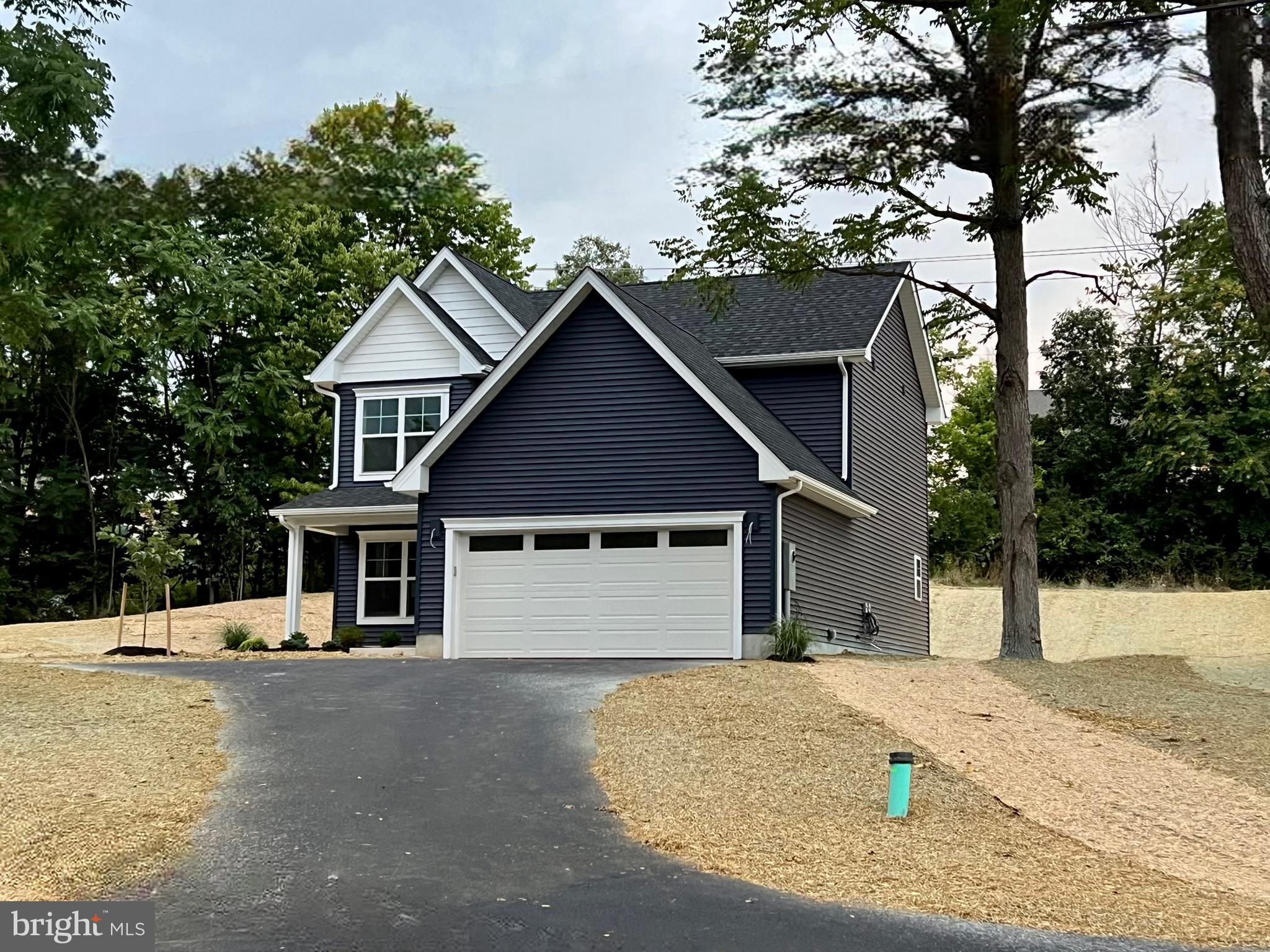 Interior photos are of the same floorplan but with different finishes - This home will have grey cabinets with a white backsplash, granite countertops, and French Grey Oak LVP!
Ready for move in NOW. This colonial built by Panhandle Homes is on over 1/4 acre unrestricted lot in the Spring Mills area! Sit on your covered front porch or enjoy the privacy of your tree-lined back yard from the rear concrete patio. The kitchen will have beautiful 42” Painted Stone cabinets with dovetail construction and soft close hinges. The countertops have been upgraded to granite with a ceramic tile backsplash. There is a large kitchen peninsula and stainless-steel, energy efficient GE appliances as well. There are three spacious bedrooms and two full bathrooms upstairs along with a half bath on the main level. The Primary Suite has a large walk-in closet, dual bowl vanity and a 5' walk in shower. The home also comes with a new home orientation, 1-year builders’ warranty for your peace of mind and a Trane HVAC system which offers a 10-year manufacturer’s warranty. The outside pictures are of the actual home as it sits today with the yard professionally landscaped, adding to the beauty and charm of this home.