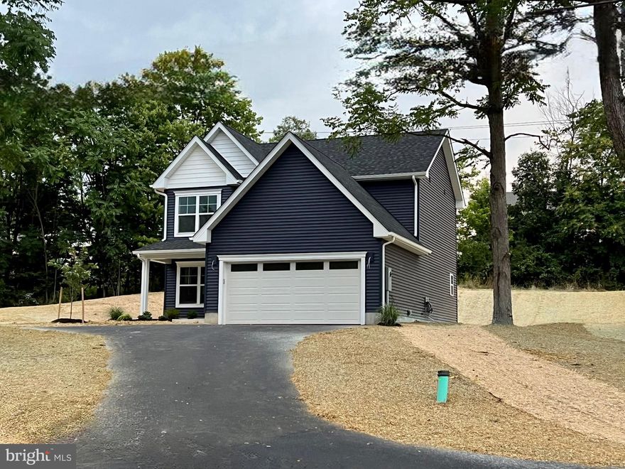 Interior photos are of the same floorplan but with different finishes - This home will have grey cabinets with a white backsplash, granite countertops, and French Grey Oak LVP! 

Ready for move in NOW. This colonial built by Panhandle Homes is on over 1/4 acre unrestricted lot in the Spring Mills area!  Sit on your covered front porch or enjoy the privacy of your tree-lined back yard from the rear concrete patio.  The kitchen will have beautiful 42” Painted Stone cabinets with dovetail construction and soft close hinges. The countertops have been upgraded to granite with a ceramic tile backsplash. There is a large kitchen peninsula and stainless-steel, energy efficient GE appliances as well. There are three spacious bedrooms and two full bathrooms upstairs along with a half bath on the main level. The Primary Suite has a large walk-in closet, dual bowl vanity and a 5' walk in shower.  The home also comes with a new home orientation, 1-year builders’ warranty for your peace of mind and a Trane HVAC system which offers a 10-year manufacturer’s warranty. The outside pictures are of the actual home as it sits today with the yard professionally landscaped, adding to the beauty and charm of this home.