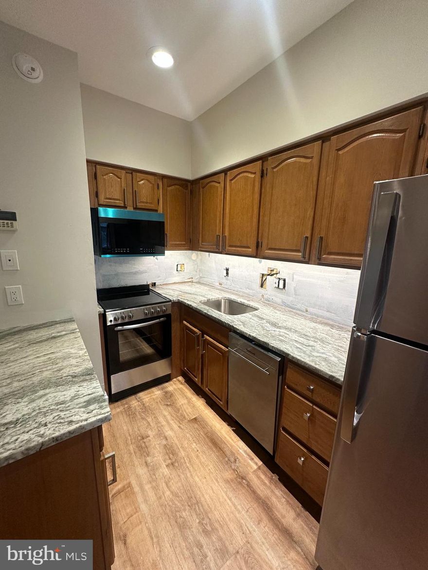 Modern comfort meets historic charm in this beautifully updated 2 bedroom, 1 bath condo located in a nationally registered historic building in the heart of Trolley Square — Wilmington’s only truly urban neighborhood you’ll want to live in, where you can stroll past historic homes to cafés, restaurants, and nightlife, without the biggest worry of city living — parking, thanks to your deeded private space.

This light-filled home features a modern open layout, two decorative fireplaces, soaring ceilings, and epic oversized windows that flood the space with natural light. The brand new granite kitchen includes new stainless steel appliances and flooring. The bathroom has been refreshed with a newly glazed tub and shower walls, new tile floor, and a custom granite vanity. Fresh paint, new bedroom flooring, in-unit washer/dryer, and central air make this home truly move-in ready.

Enjoy the shared front porch and huge basement storage area. Walk to work in Center City, enjoy evening strolls on the Riverwalk, or hop on I-95 in a minute for an easy commute to Philadelphia, Newark, or anywhere you need to go. This home perfectly blends urban walkability, modern convenience, and timeless historic character.