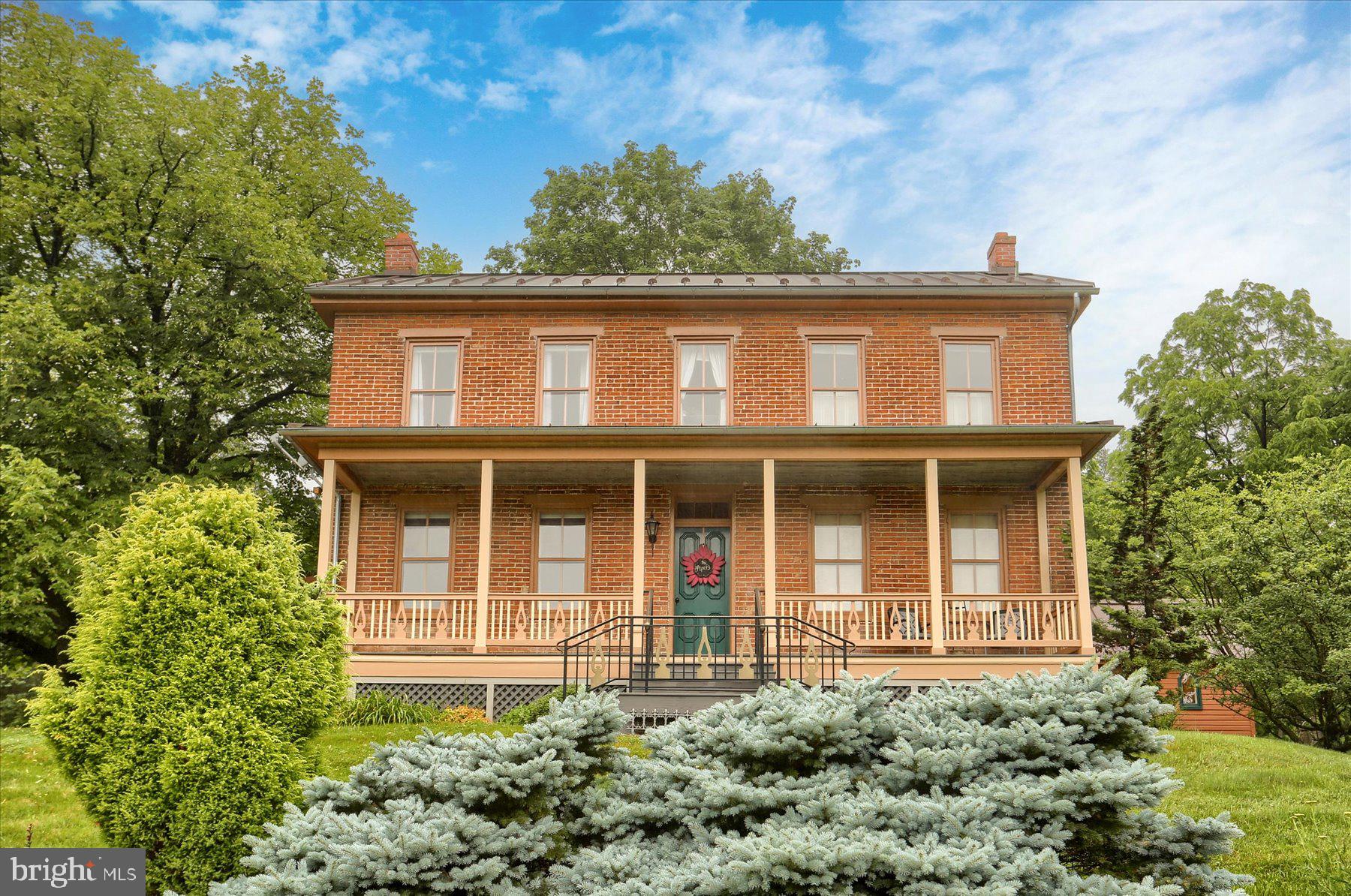 An outdoor lover's dream estate nestled in an idyllic rural setting! With over 38 mostly wooded acres and nearly 1,000 feet of Big Spring Creek frontage, this property offers excellent deer and turkey hunting, along with direct access to some of the best trout fishing in Pennsylvania. The three-bedroom, two-bath circa-1870 brick farmhouse has been sensitively restored while retaining much of its historical charm, including original hardwood flooring throughout much of the home. Three-car garage. Heated in-ground pool and adjacent screened dining area. The original chapel, located directly adjacent to the house, is perfect for an artist's studio, and the large bank barn offers ample storage and endless possibilities. Don't miss this unique opportunity to experience peaceful country living at its finest!