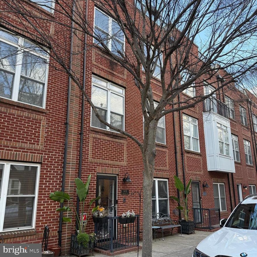 McHenry Pointe in the desirable Locust Point neighborhood! This beautifully maintained home features hardwood flooring and stairs throughout. The entire home is wired for sound. The first level includes a flexible space that can serve as a bedroom or den, a fully remodeled half bath with Restoration Hardware
fixtures and marble flooring, and a laundry area with Elfa built-ins and pocket doors. On the second level, you'll find a spacious living room, dining room, and kitchen with cherry cabinets, granite countertops, and a matching backsplash. The adjoining family room boasts extensive trim work and is wired for sound. The half bath on the level was fully renovated with Restoration Hardware fixtures and marble flooring. The third level offers three bedrooms and two full baths, including a luxurious owner’s suite with a spa-like bath. Custom-built closets are featured throughout the home for optimal storage. The rooftop level is an
entertainer’s dream, complete with a customized wet bar, dual fridges, and an oversized dual-blade fan. The expansive rooftop deck offers breathtaking city skyline views. Located just minutes from Fort McHenry, the Inner Harbor, Latrobe Park, and popular local restaurants and entertainment, this home also provides easy access to I-95 for seamless commuting. EV charging station already installed for your convenience!  All office furniture on the first level and planters on the ground floor, front and back are included.