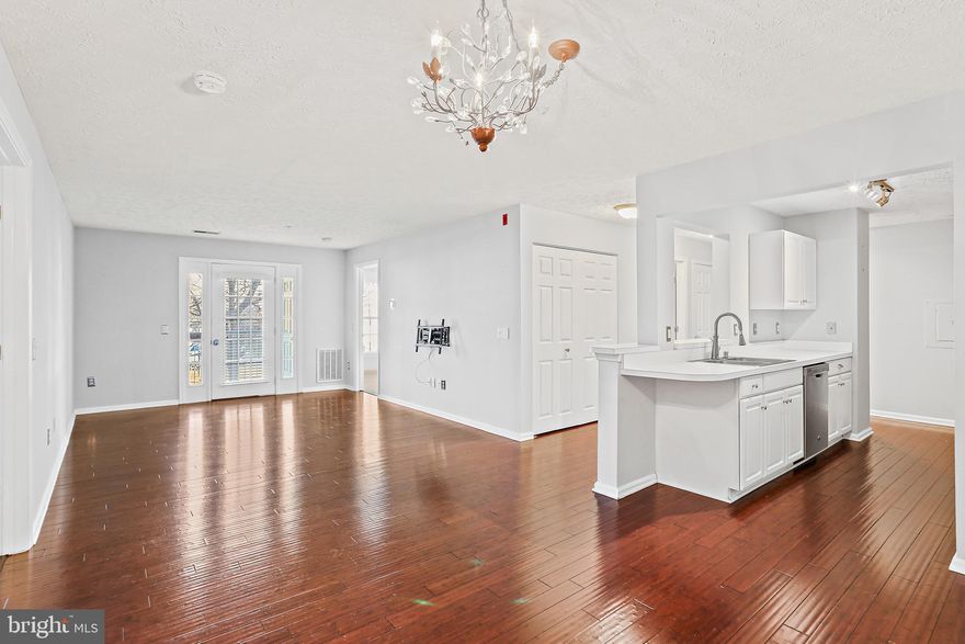 This Well Maintained, 2 Bedroom, 2 Bath, 2nd Floor Condominium in the sought after Windgate Community checks all the boxes! Step into the Home to find the Galley Kitchen featuring Gas cooking, and stainless steel applianes and a pass through to let in plenty of Natural Light. Off the kitchen is the open concept Dining Room with gleaming Hardwood flooring that flows seamlessly throughout the Main living space. The Bright Living Room with French Door to the Patio  is  the perfect spot for morning coffee. Next is the Primary Bedroom with a Walk-In Closet and Private Bath. Convenient features of this home include the large Second Bedroom complete with a newer built-in closet system for the walk-in closet,  another Full Bath accessible from the hallway and the second Bedroom, plenty of closet space and in-unit laundry. This home is located close to shopping, dining, major commuter routes and an abundance of outdoor and water activities on the Severn River! Don’t Miss It!