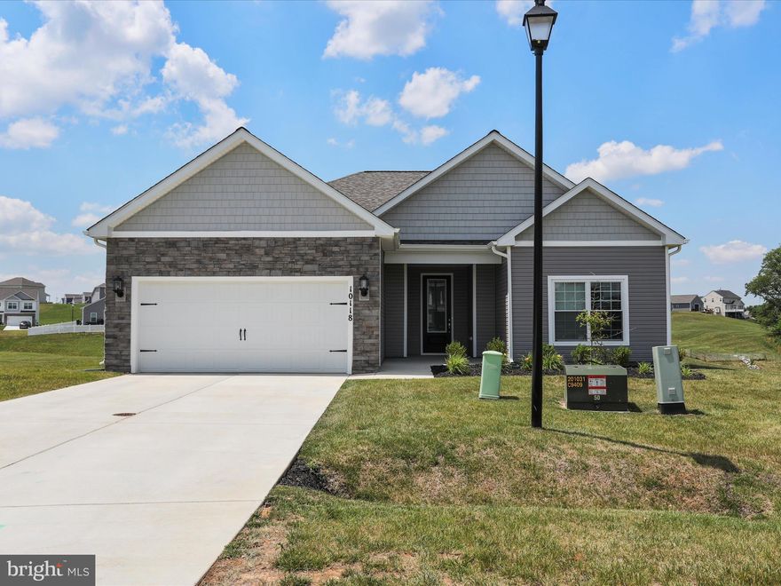 1 year old construction ready for move in! This gorgeous 1 level LGI home is barely lived in and ready for you! The brand new kitchen boasts stainless appliances and granite counters with a a huge penninsula facing the open living room. LVP flooring throughout is both sturdy and easy to clean and maintain.  Good sized bedrooms surround the living area on opposite sides of the home.  Sliding doors lead to a covered patio overlooking the neighborhood hills.   If you want new construction without waiting- this one is for you!