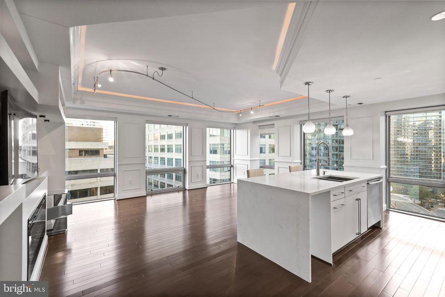 Luxury, Location, and Value, all in one exceptional residence. Priced to sell, this stunning 17th-floor corner condo at The Waterview offers unmatched elegance, breathtaking city views, and high-end finishes throughout.
This 2 bedroom, 2.5 bath home features floor-to-ceiling windows overlooking the D.C. skyline, hardwood floors throughout, a electric fireplace, and a gourmet kitchen with Viking stainless-steel appliances, built-in cooktop, wall oven, and sleek cabinetry. The spacious primary suite offers a spa-inspired ensuite bath and generous closet space, while the second bedroom with its own bath provides flexibility for guests or a home office.

Renovated in 2019, the home showcases custom wallpaper and headboard, upgraded luxury lighting, LV flooring, closet organizers, and a mounted TV that conveys along with the bookshelf and counter chairs. Gas cooking and electric heat are provided, and water is included in the condo fee.

Residents enjoy five-star amenities including 24-hour concierge and valet service, a rooftop terrace with panoramic monument views, a fitness center, and access to Le Méridien’s room service and fine dining. Two assigned garage spaces convey (R3-22 & R3-22T).