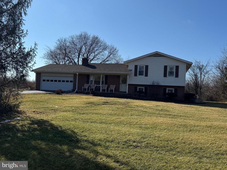 This lovely split level home features 3 bedrooms and 2 full baths. Your lot is over 6 and 1/2 acres. Wow! The home has fresh paint and new flooring. The spacious kitchen features granite countertops and stainless-steel appliances. The living room includes a brick, raised-hearth wood-burning fireplace. This will keep you warm in those winter months. The upper level of the home features a large primary with hardwood floors and a private entry to bathroom. There are two more generously sized bedrooms with hardwood floors and ceiling fans. The lower level features a large family room with carpet and recessed lighting. This is a great space to gather. A laundry closet keeps your GE washer and dryer tucked from view. There is a second full bath of this level. Outside you have two outbuildings for plenty of storage. This home has everything you've been looking for! Professional photos coming soon!