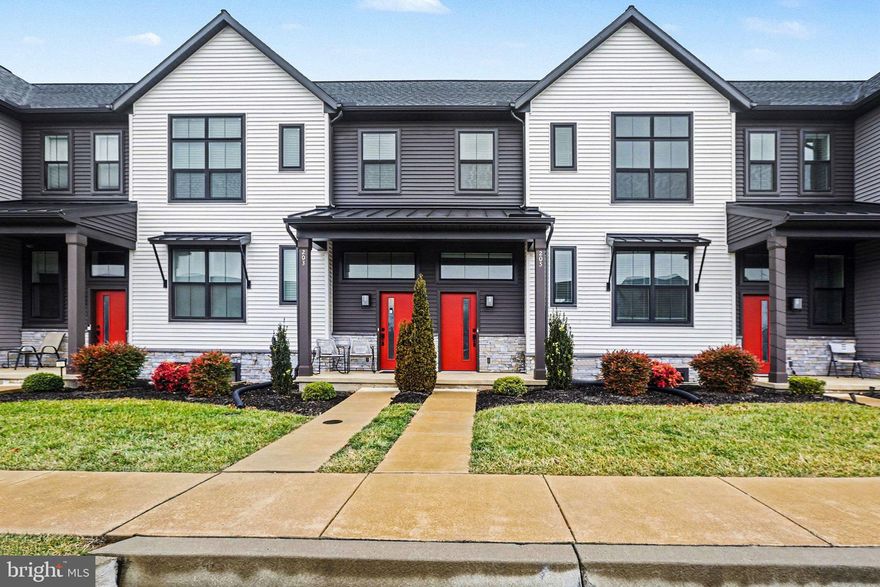 Welcome to this beautifully maintained, like-new townhome built in 2020, ideally located in the heart of Mechanicsburg Borough. Offering 3 bedrooms, 2.5 bathrooms, and nearly 1,900 square feet of living space, this home blends modern style with everyday comfort.

The main level features an open-concept layout with durable vinyl plank flooring throughout the living, dining, and kitchen areas—perfect for entertaining or daily living. The kitchen is a standout with quartz countertops, tile backsplash, stainless steel appliances, a large center island, and pantry storage. Just off the rear-entry one-car garage, enjoy easy access and a private patio for outdoor relaxation.

Upstairs, you’ll find all three bedrooms, two full baths, and a conveniently located laundry room. The spacious owner’s suite includes a large walk-in closet and private bath with a double vanity and stall shower. A full, unfinished basement offers plenty of storage and future finishing potential. Custom blinds are included throughout both levels.

Located within the growing Legacy Park community, Madison Court is designed for connection and convenience with planned walking trails, green space, retail, and more. A 1 minute walk to the Market Square including Wolf Brewing Co, Luna Italian Cuisine, Down To Earth Cafe & MORE.  Just minutes from Route 114 and major commuter routes. Move-in ready and coming soon—don’t miss your opportunity to make it yours.
