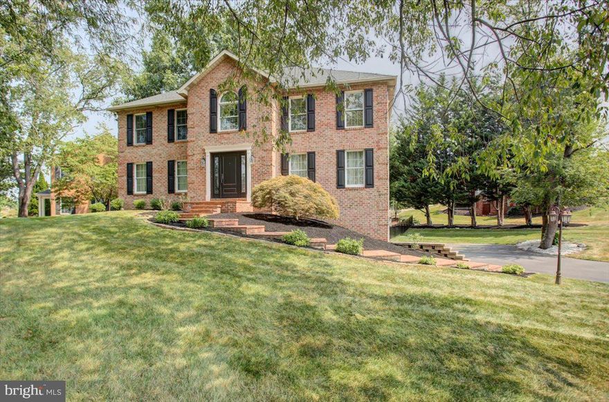 You will be amazed by this meticulously maintained brick home nestled in sought-after Brightwood Acres East, offering the perfect blend of traditional charm and modern functionality. As the photographer said, "this is one of the nicest homes I've seen in months." From the brick-lined walkway, step inside to discover a bright and open floor plan featuring gleaming hardwood floors throughout the main level and luxury vinyl plank flooring upstairs. The heart of the home is the gourmet kitchen, complete with granite countertops, upgraded wood cabinets, gas cooking, an oversized island with guest seating, and ample space for entertaining. Enjoy an extended meal in the formal dining room, or take time for yourself in the living room with a book by the gas fireplace. Upstairs, the spacious primary suite feels like a peaceful retreat with vaulted ceilings and a spa-like bathroom with a soaking tub, separate shower, and dual vanities. All bathrooms boast sparkling granite countertops and ceramic tile floors. Three additional bedrooms provide plenty of room for family or guests, while a fifth bedroom has been thoughtfully transformed into a state-of-the-art laundry room with built-in storage and workspace. The partially finished basement expands your living space with a cozy lounge area, wet bar, and beverage refrigerator—ideal for game nights or casual entertaining. And there’s plenty of storage in the unfinished lower level space. Step outside to a fenced-in backyard oasis where you can spend quiet moments on the patio or entertain guests on the deck – an ideal setting for both relaxation and celebration. Whole house humidifier installed by current owners. All this, just minutes away from major commuter routes, Meritus Hospital, schools, restaurants and shopping. Across the street from Black Rock Golf Course and Washington County Regional Park. No HOA fees or city taxes. Don’t miss this exceptional opportunity to own a home that truly has it all!