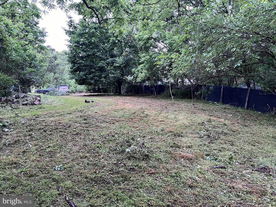 Unrestricted lot with public utilities including water, sewer (access available), and electric service pole. Situated in a prime location on the edge of town in Berkeley Springs, this .31 acre property offers a cleared and level building site, perfect for constructing your next project.